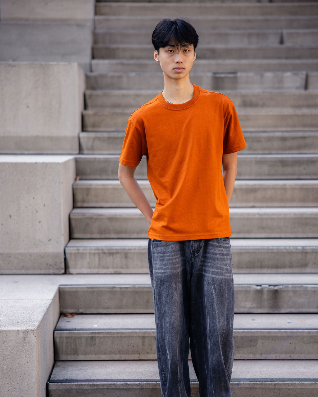 Male model wearing an American Apparel 9001 Unisex Oversized Fit Super Heavyweight T-shirt - Rust