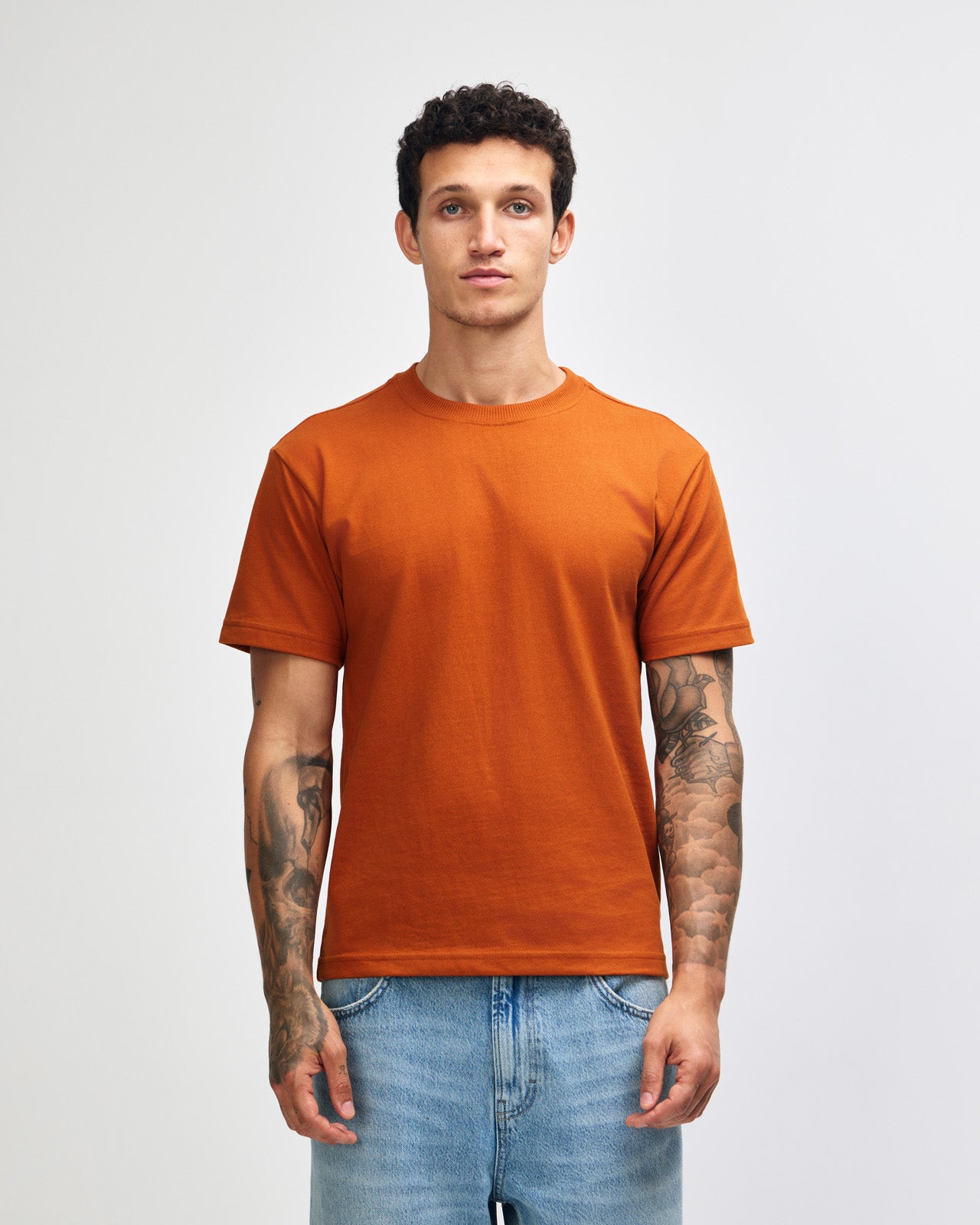 Male model wearing an American Apparel 9001 Unisex Oversized Fit Super Heavyweight T-shirt - Rust