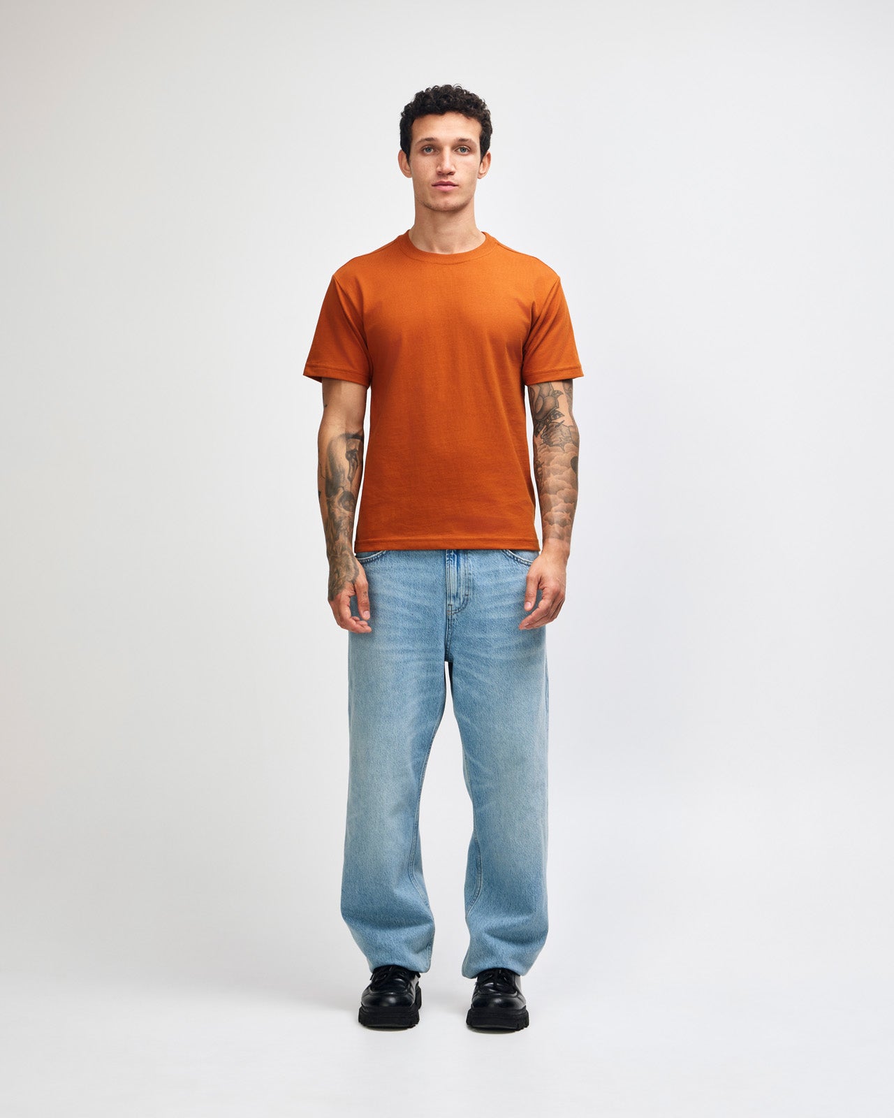 Male model wearing an American Apparel 9001 Unisex Oversized Fit Super Heavyweight T-shirt - Rust