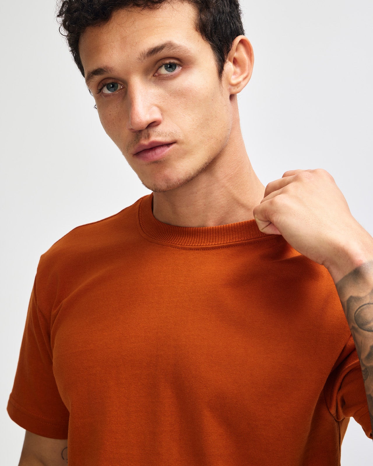 Male model wearing an American Apparel 9001 Unisex Oversized Fit Super Heavyweight T-shirt - Rust