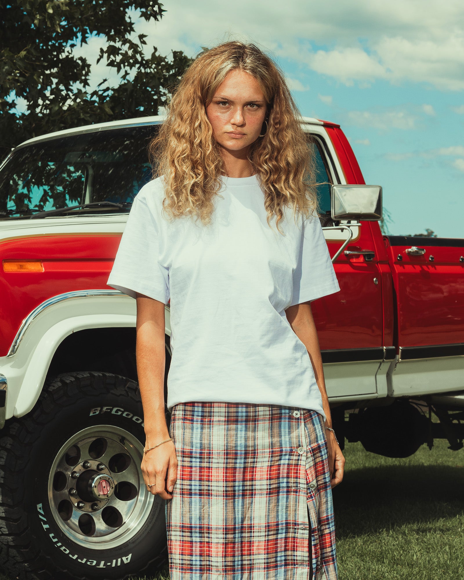 Female model wearing an American Apparel 9001 Unisex Oversized Fit Super Heavyweight T-shirt - white