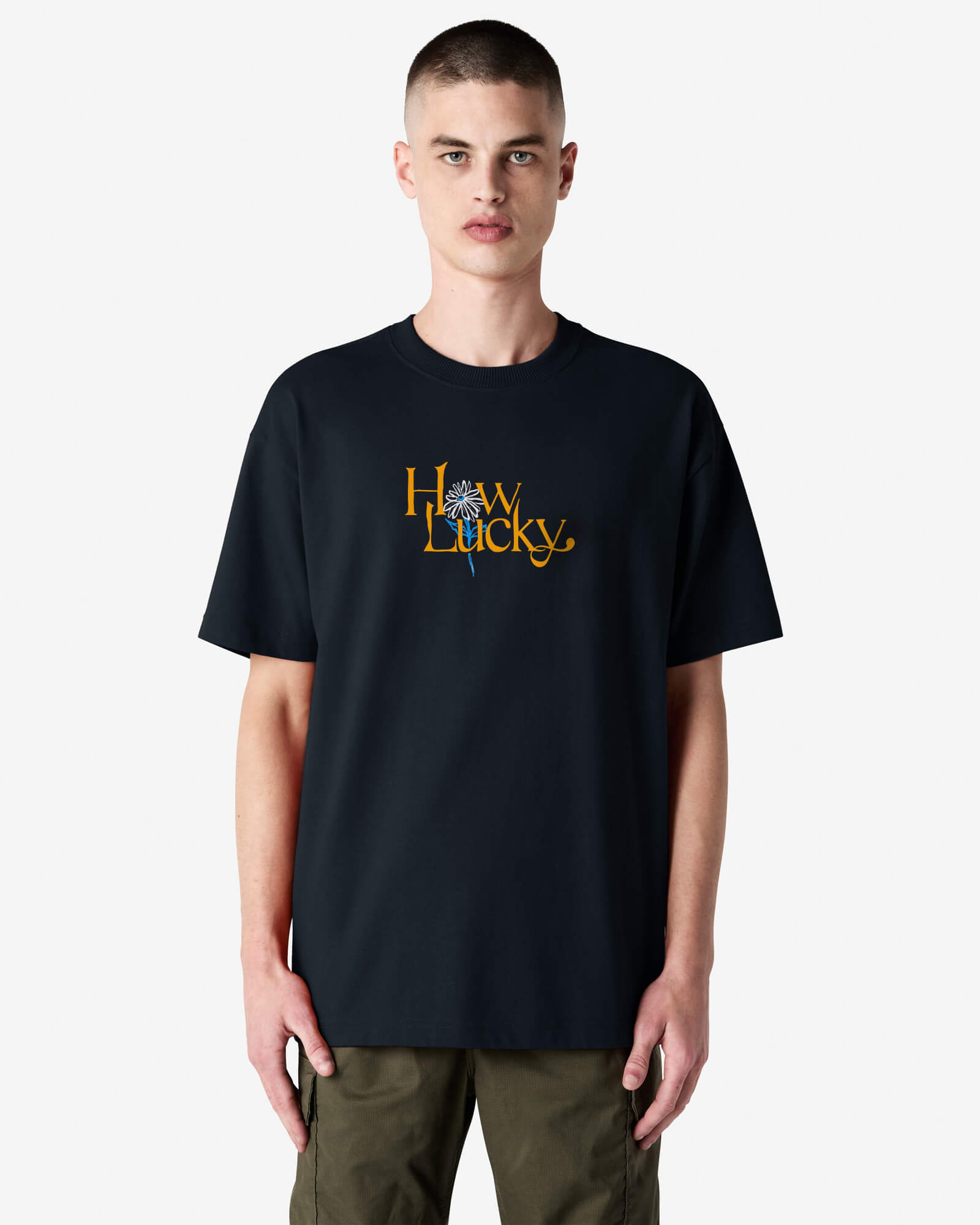Person wearing a black t-shirt with 'How Lucky' text on a white background-black
