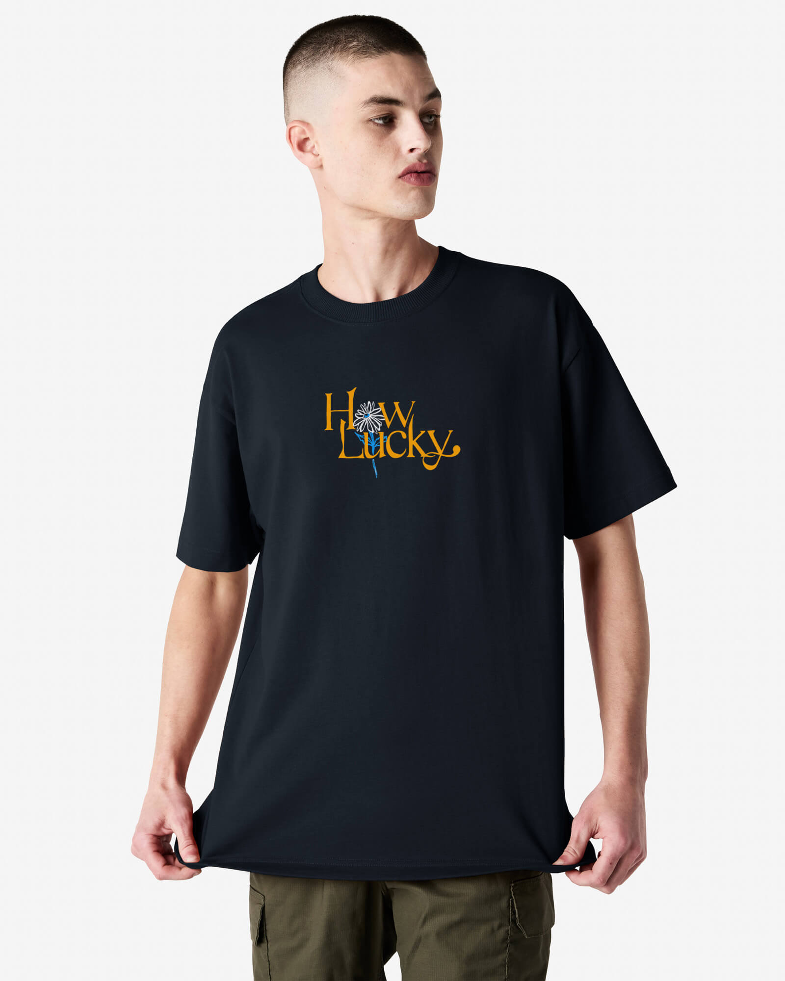 Person wearing a black t-shirt with yellow text and design on a white background-black