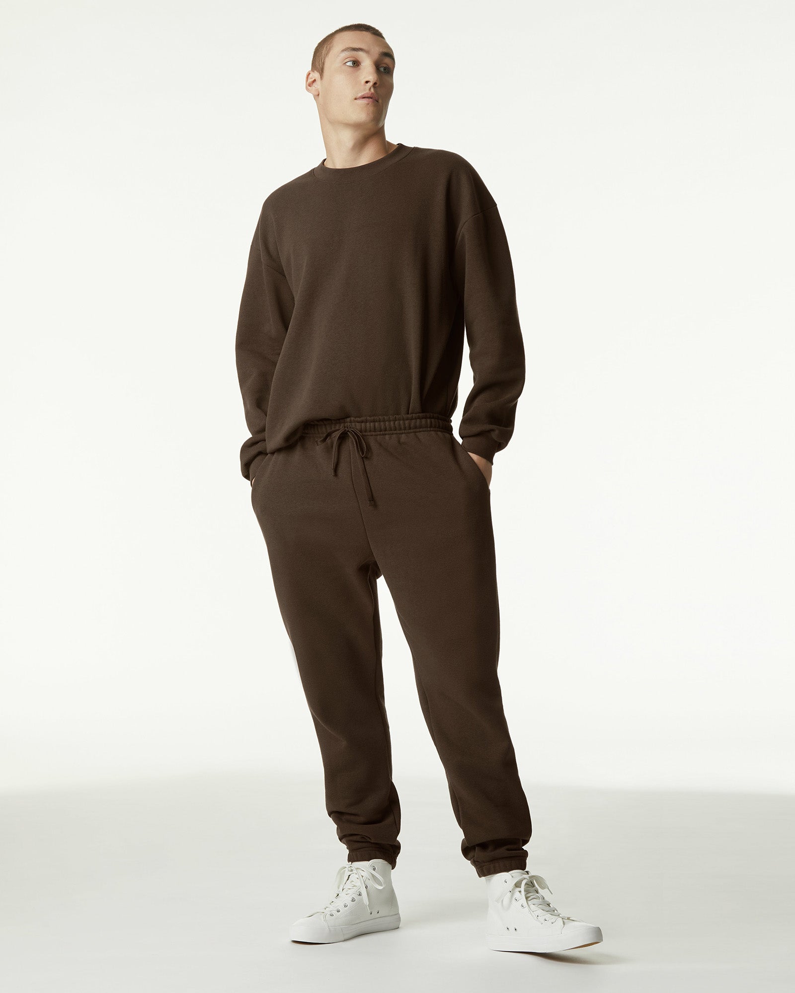 Male model standing and wearing Brown Crewneck Sweatshirt & Sweatpants Tracksuit Set (front pose) -brown