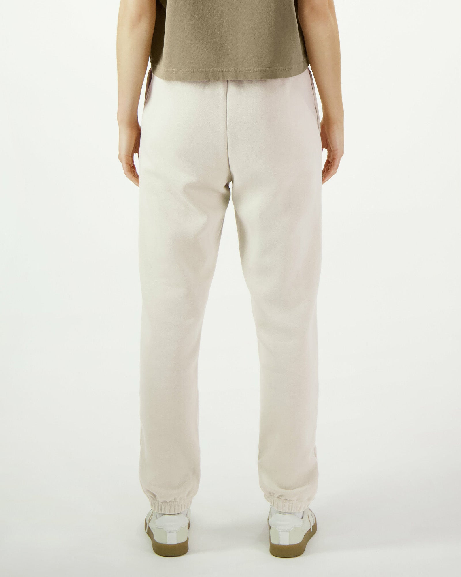 Model wearing a bone colour  American Apparel sweatpants (back pose) -bone