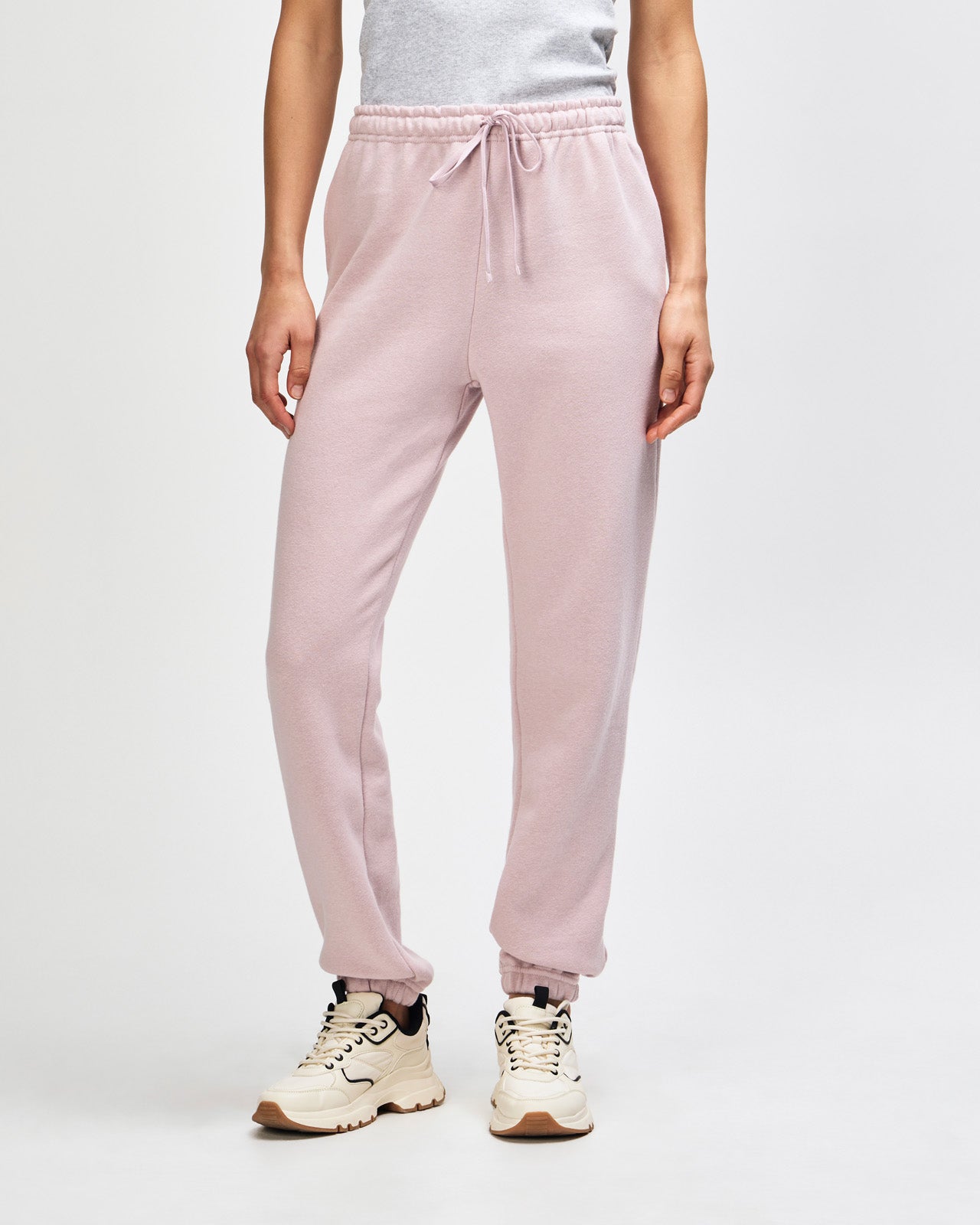 Female model wearing American Apparel Sweatpants (front pose) -blush