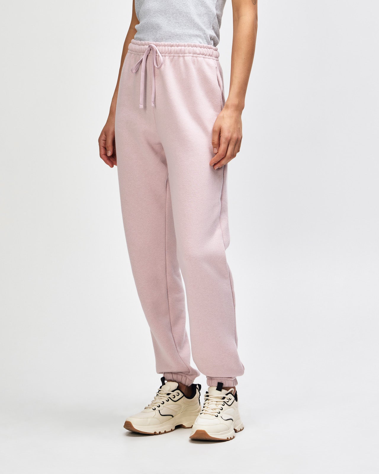 Female model wearing American Apparel Sweatpants (front pose) -blush