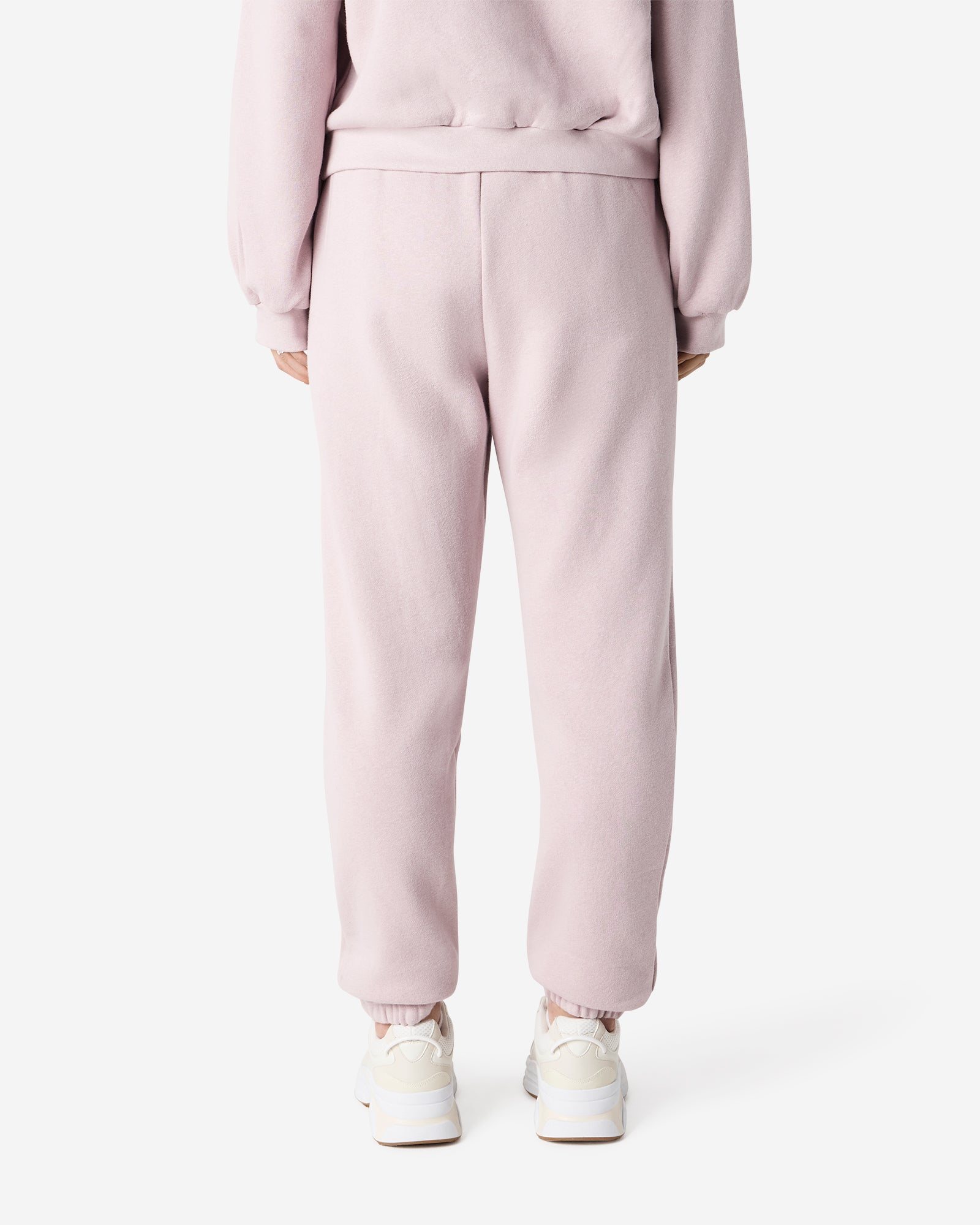 Female model wearing American Apparel Blush Sweatpants (back pose) -blush