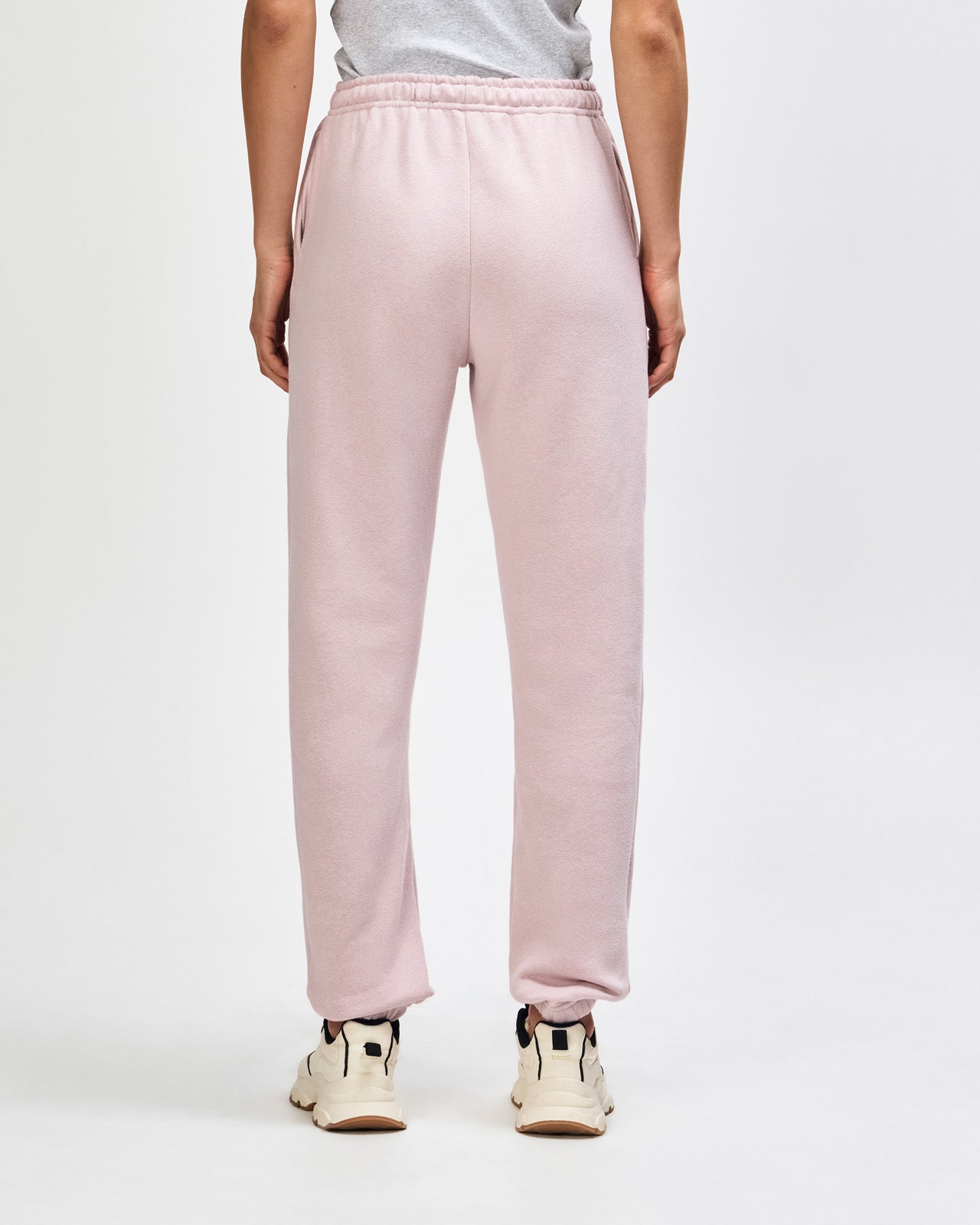 Female model wearing American Apparel Sweatpants (front pose) -blush
