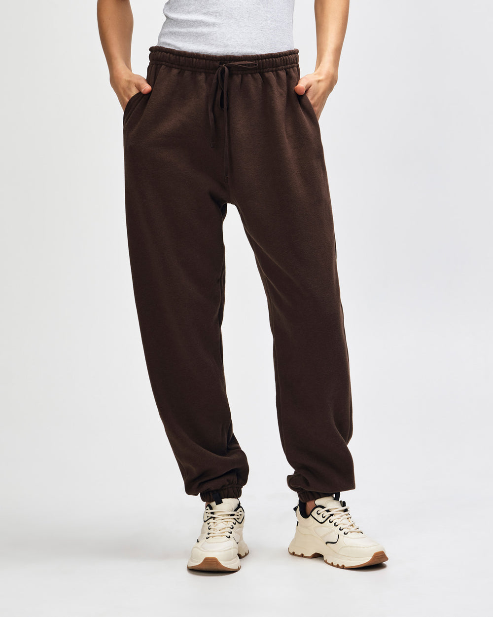 image of Unisex  Sweatpants : Female model wearing American Apparel Sweatpants (front pose) -brown