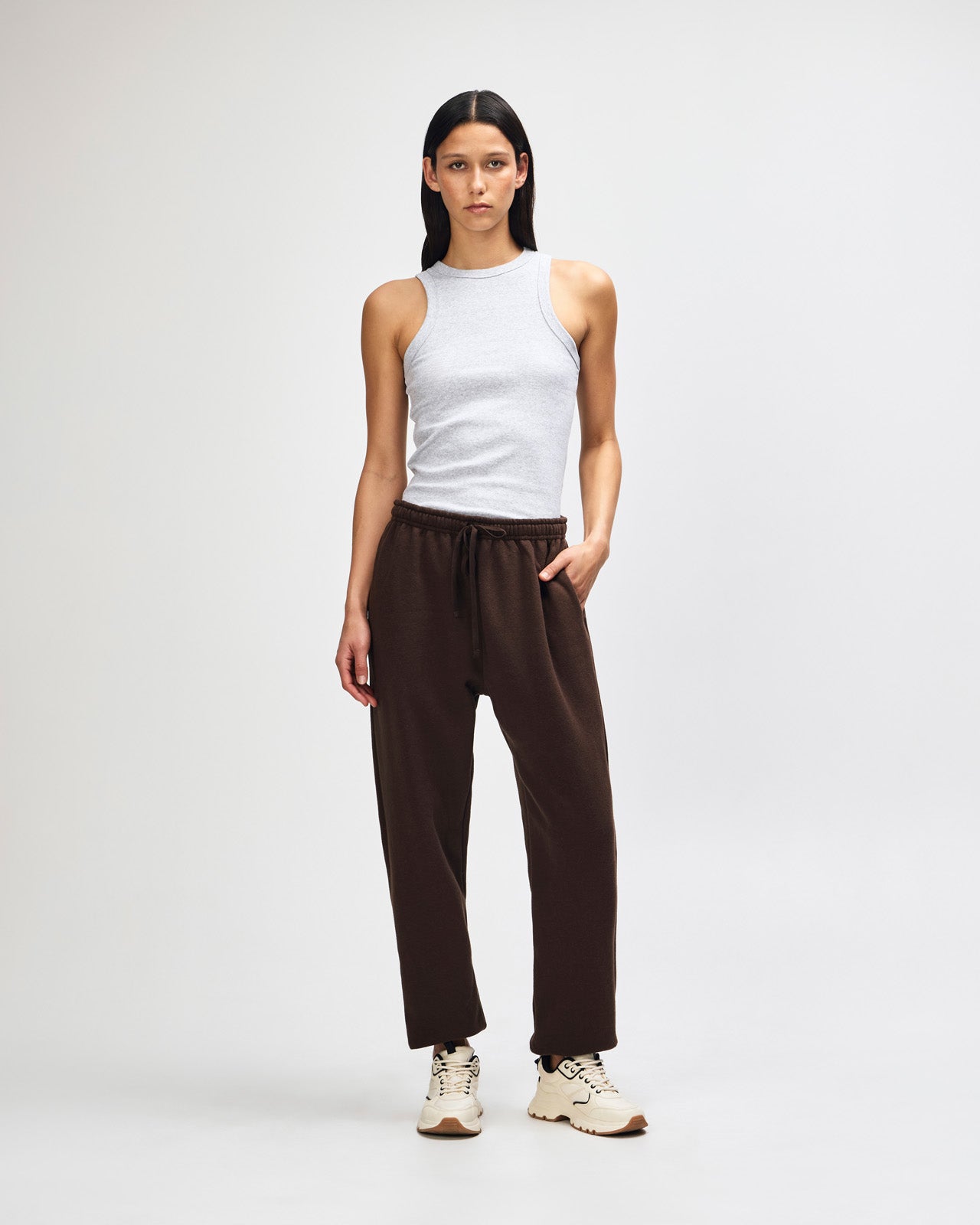 Female model wearing American Apparel Sweatpants (front pose) -brown