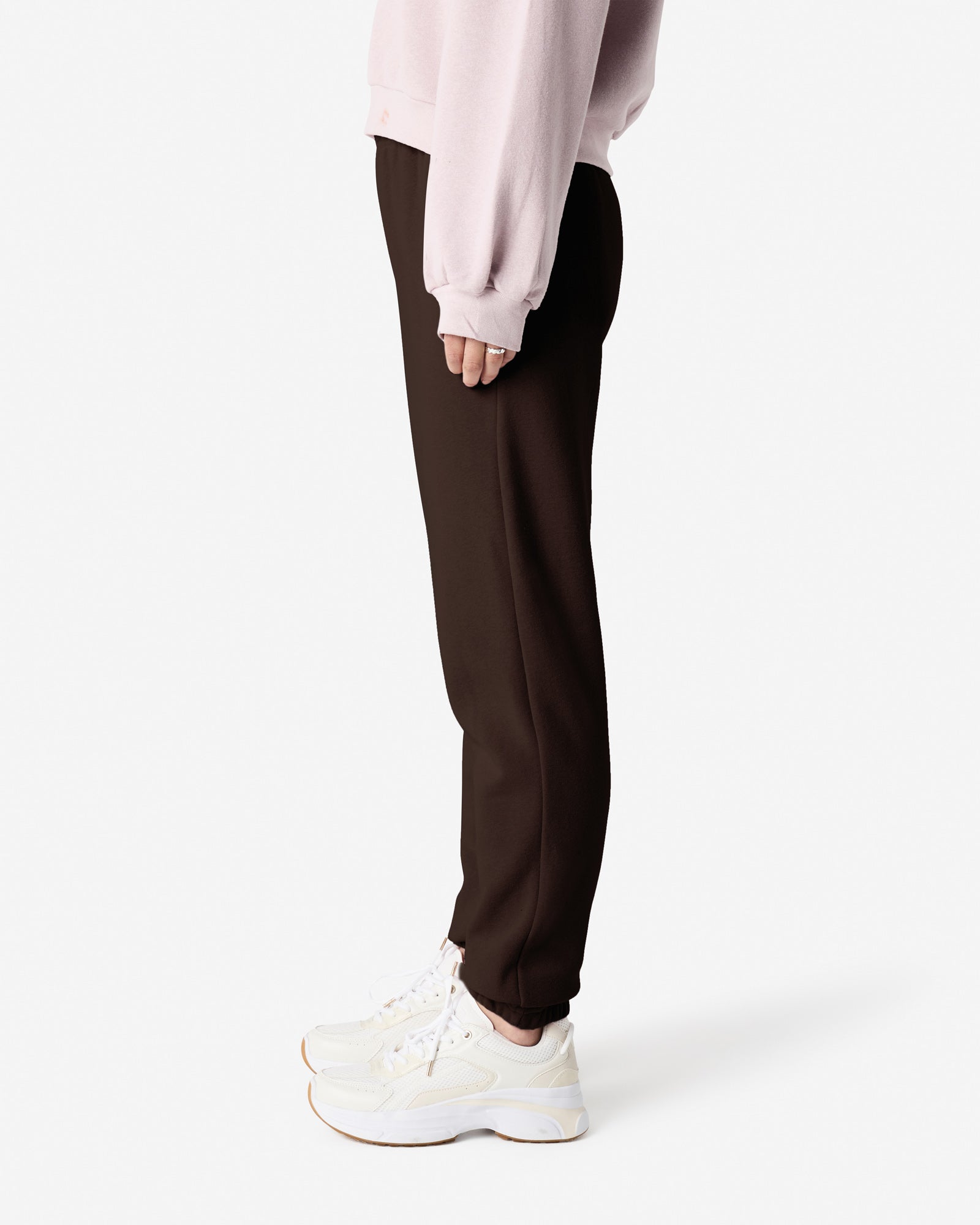 Female model wearing American Apparel Brown Sweatpants (side pose) -brown