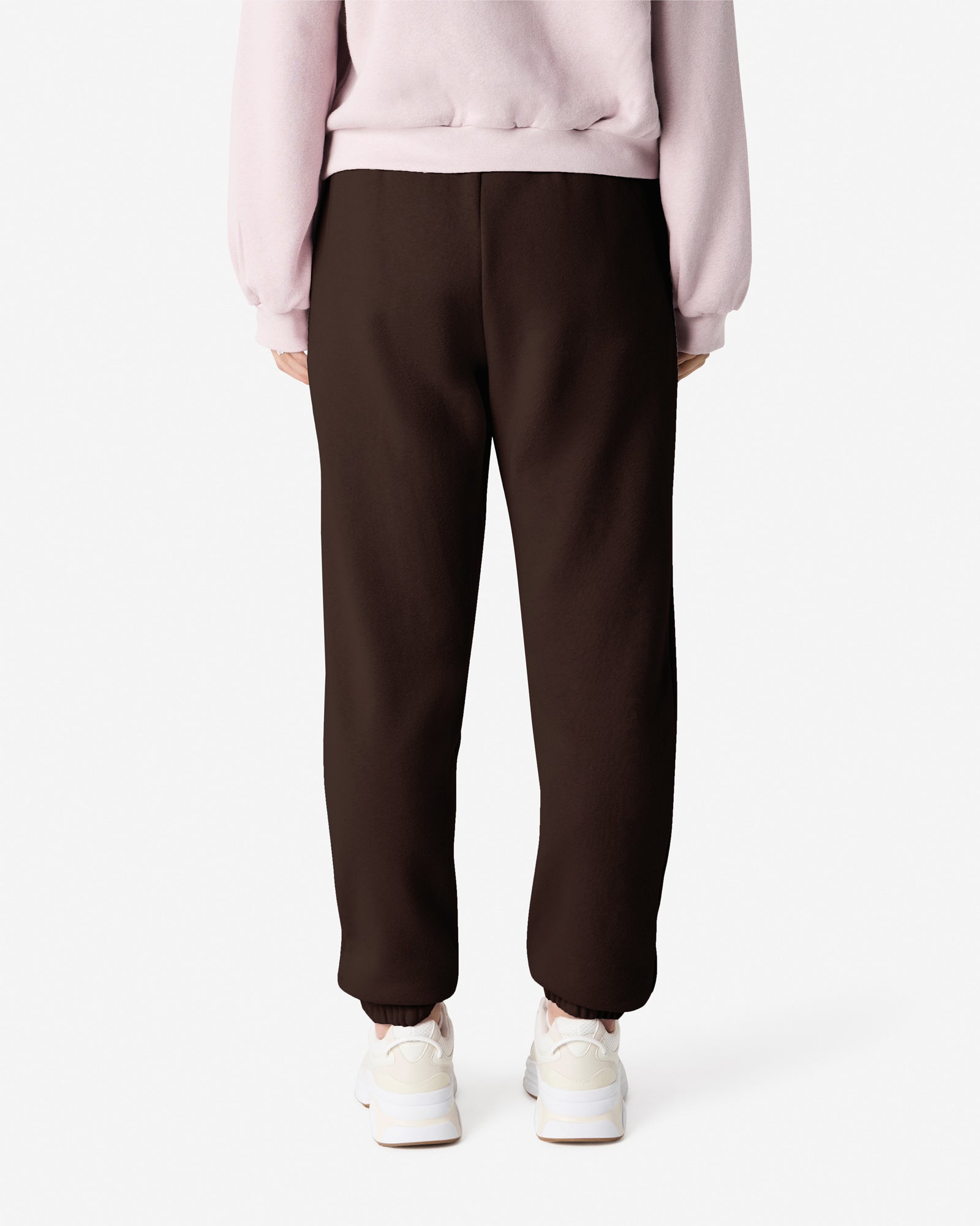 Female model wearing American Apparel Brown Sweatpants (back pose) -brown
