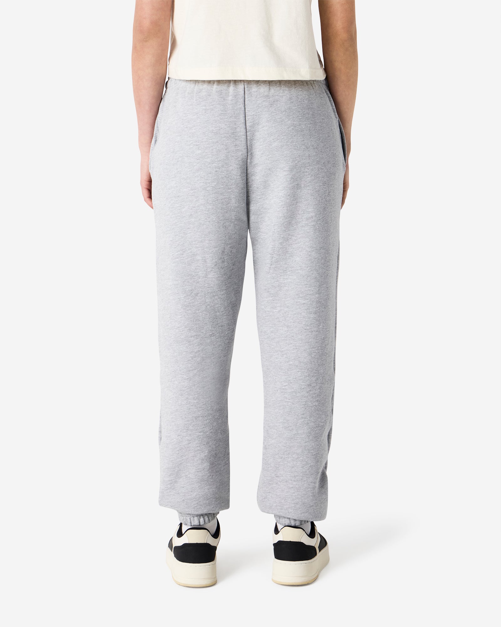 Female model wearing American Apparel Heather Grey Sweatpants (back pose) -heather grey