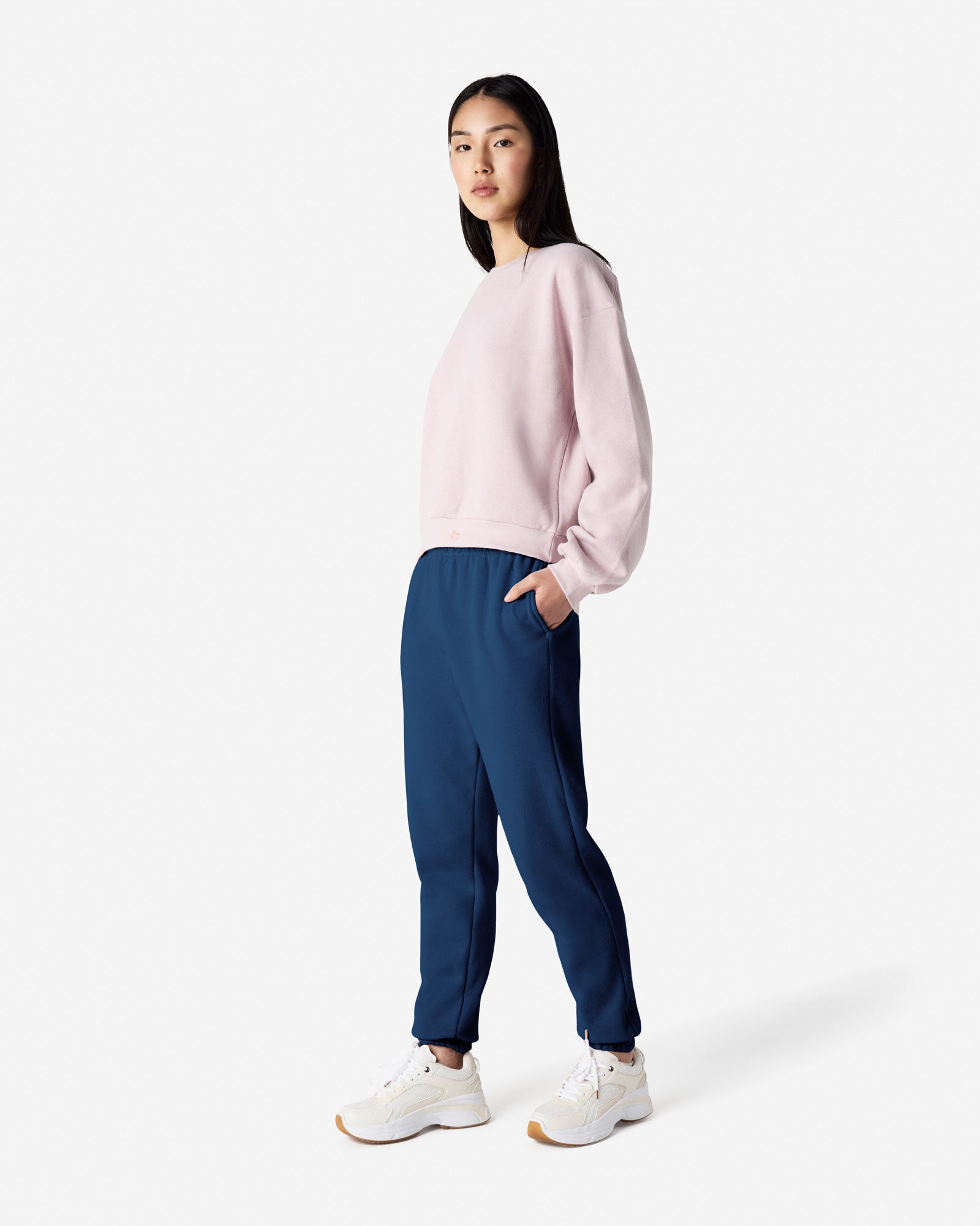 Female model wearing American Apparel Sea Blue Sweatpants (front pose) -sea blue