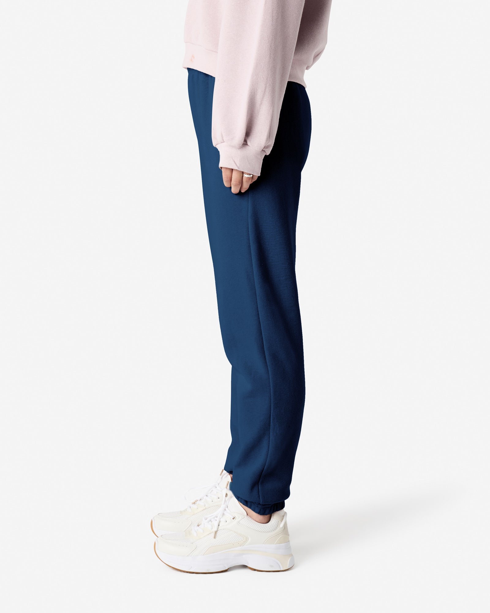 Female model wearing American Apparel Sea Blue Sweatpants (side pose) -sea blue