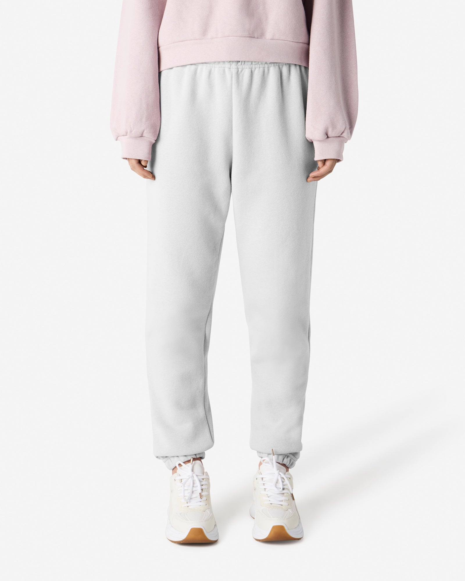 Female model wearing American Apparel White Sweatpants (front pose) -white