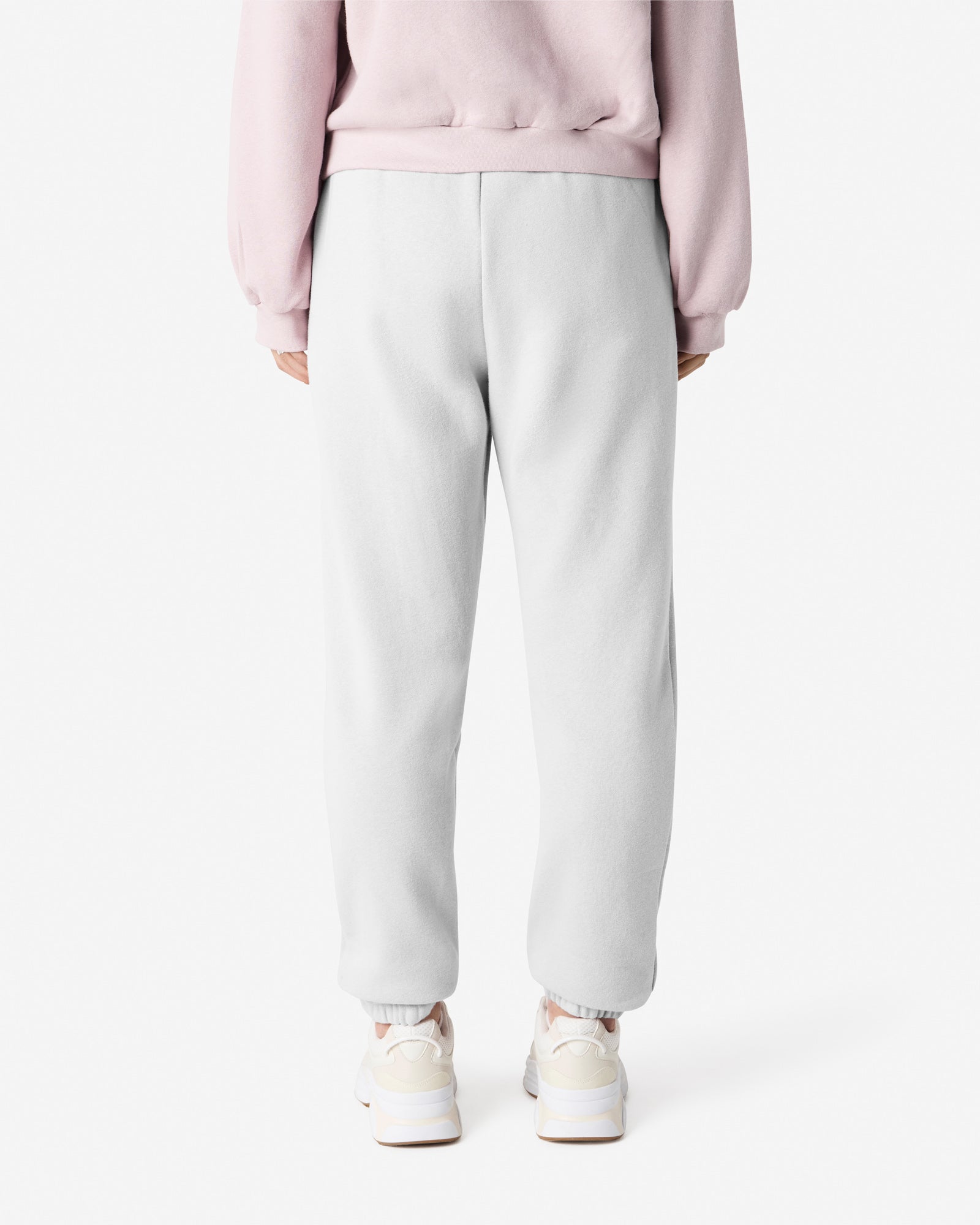 Female model wearing American Apparel White Sweatpants (front pose) -white