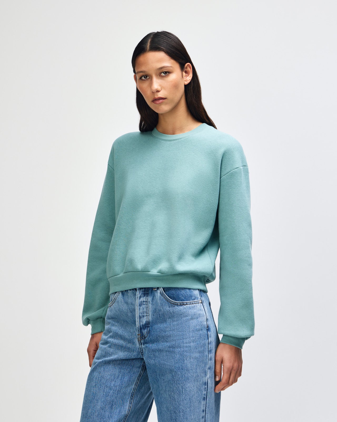 Model wearing an arctic colour sweatshirt pairing with blue jeans (front pose) -arctic