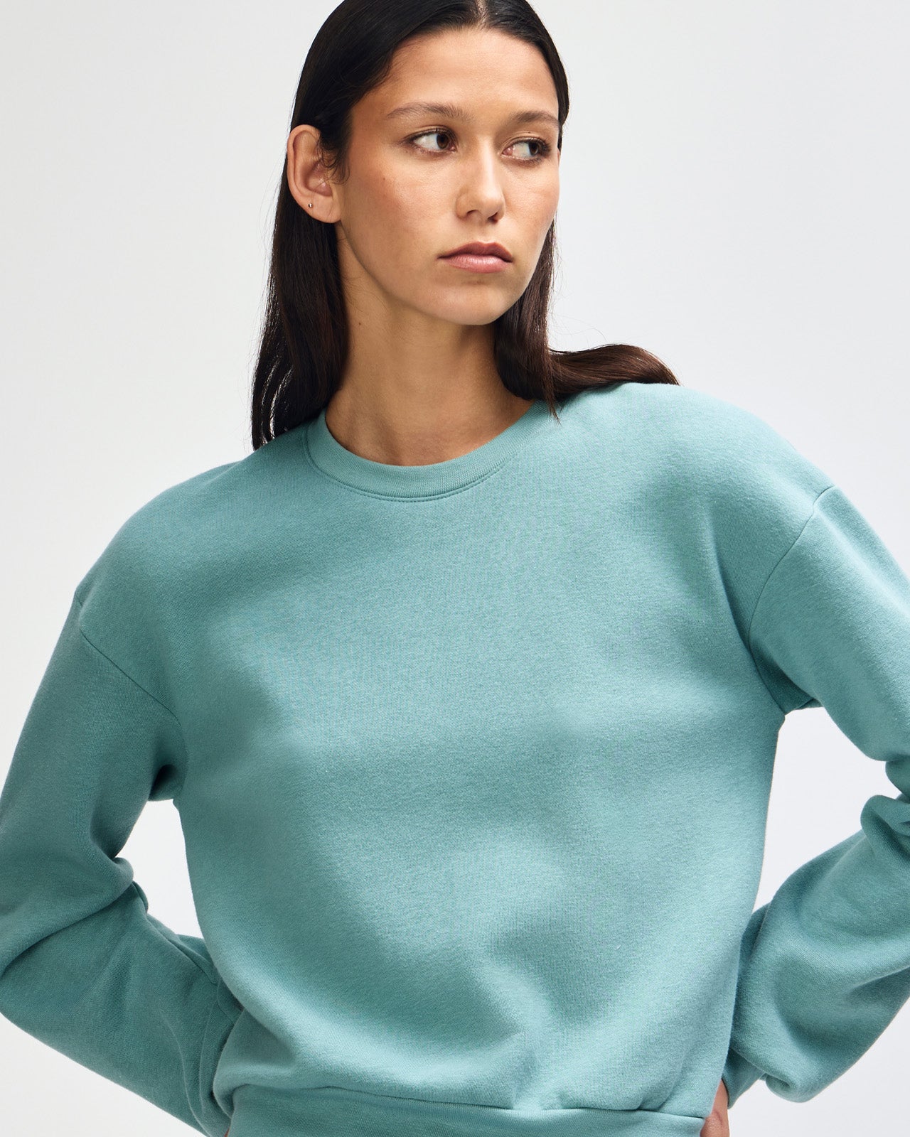 Model wearing an arctic colour sweatshirt pairing with blue jeans (front pose) -arctic