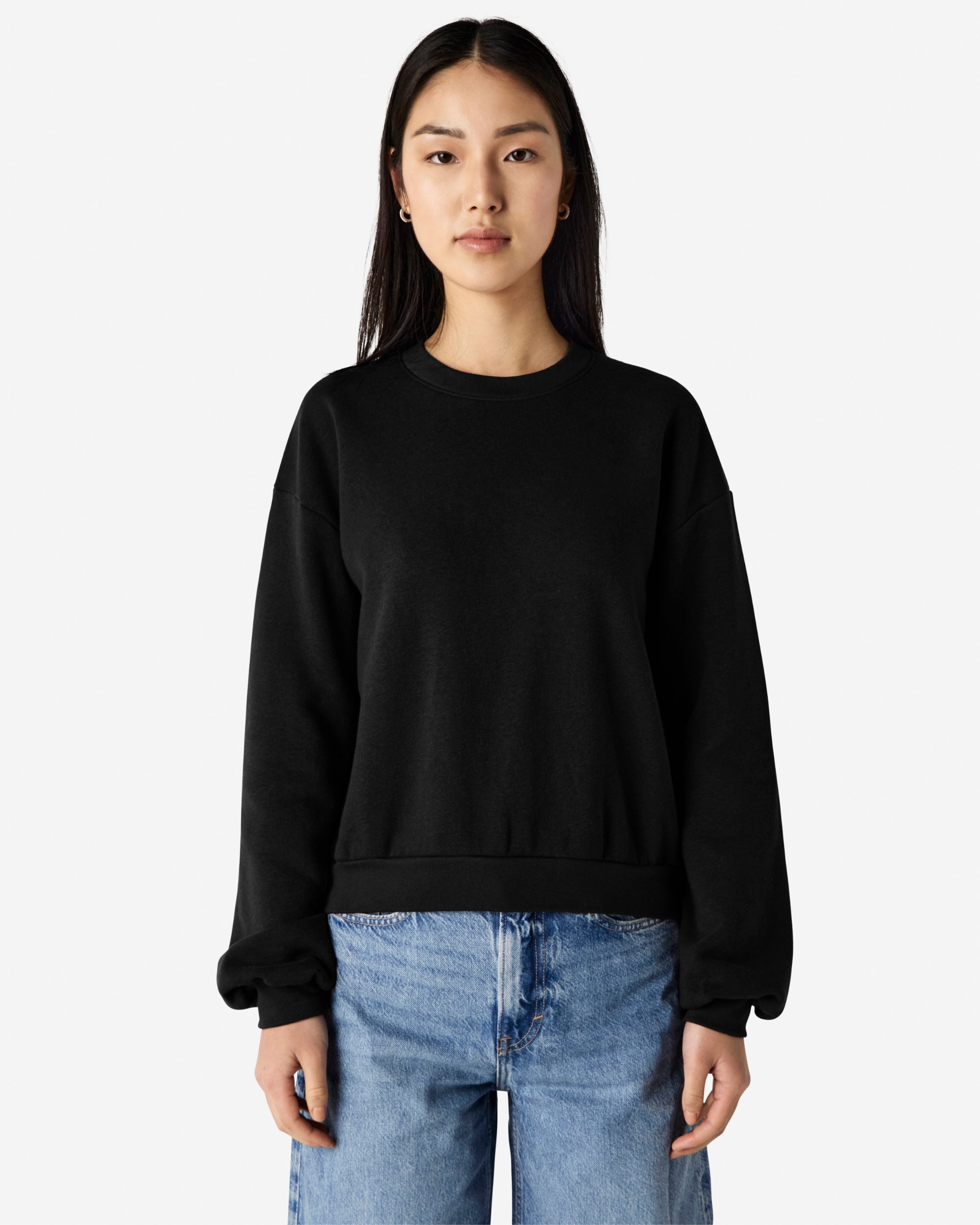 Model wearing a black colour sweatshirt pairing with blue jeans (front pose) -black