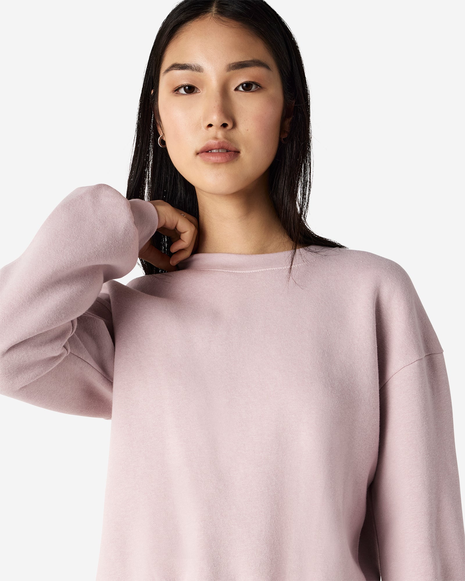 Model wearing a blush colour sweatshirt pairing with blue jeans (front pose) -blush