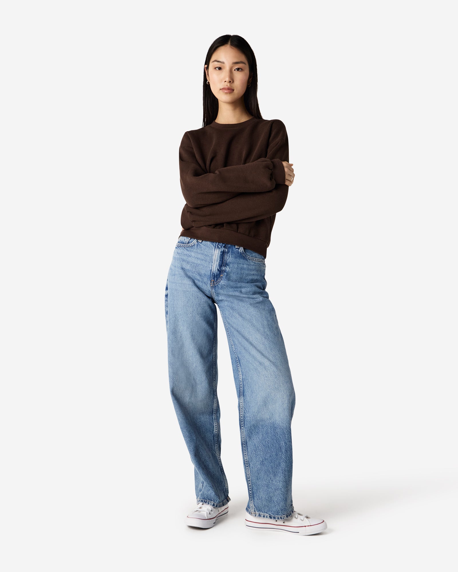 Model wearing a brown colour sweatshirt pairing with blue jeans (front pose) -brown