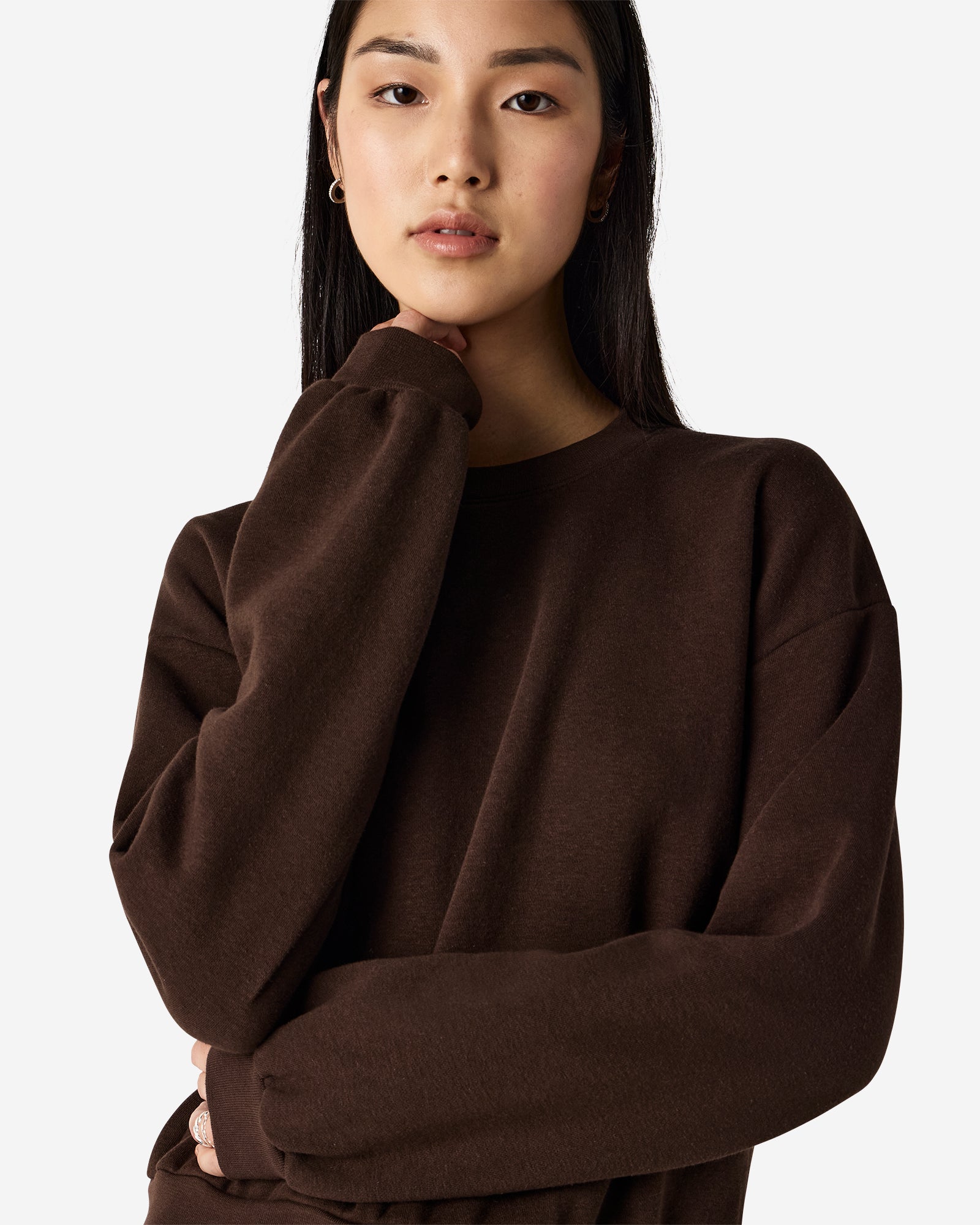 Model wearing a brown colour sweatshirt pairing with blue jeans (front pose) -brown