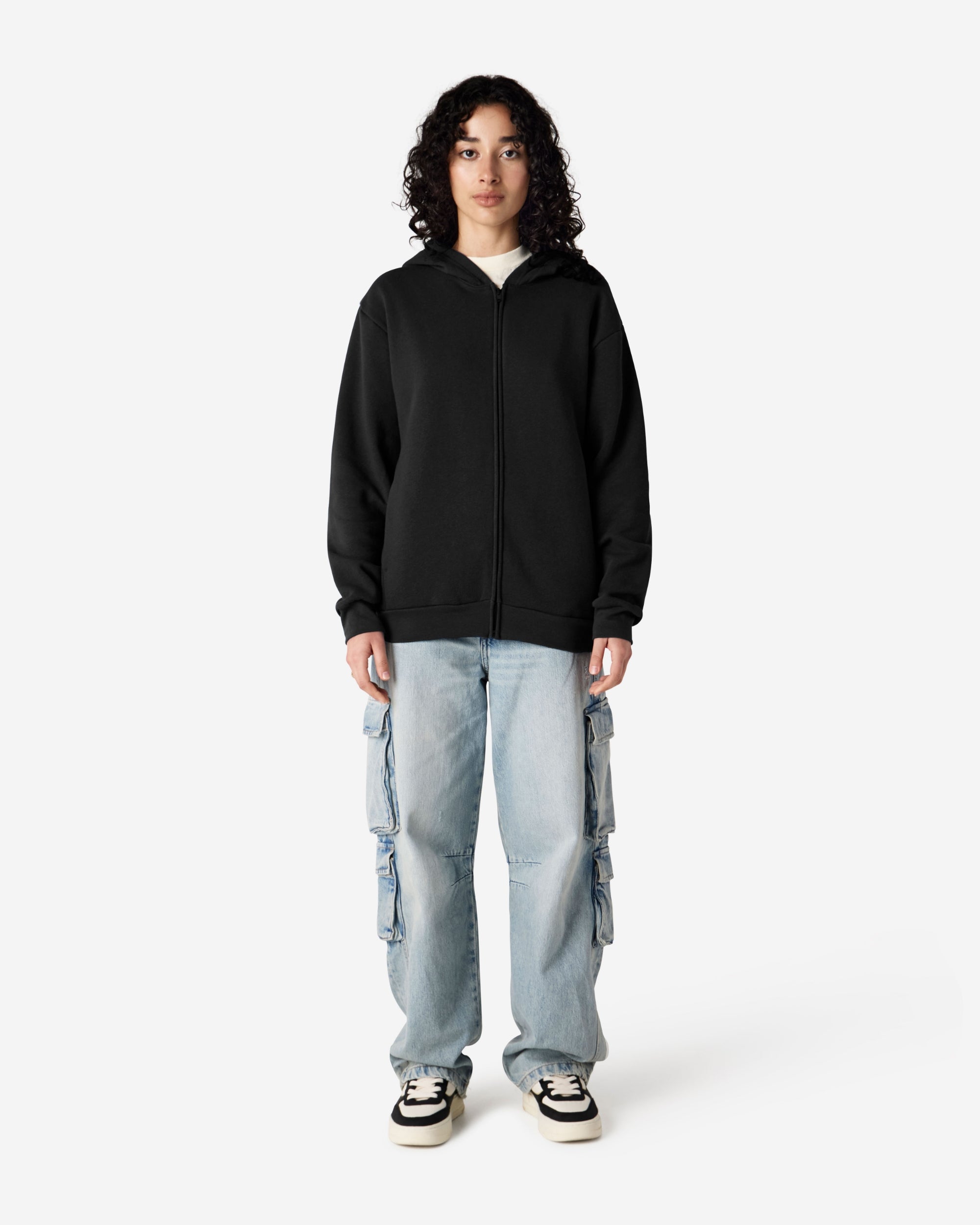 Female model wearing Reflex Unisex Full Zip Hooded Sweatshirt pairing with blue jeans (front pose) -black