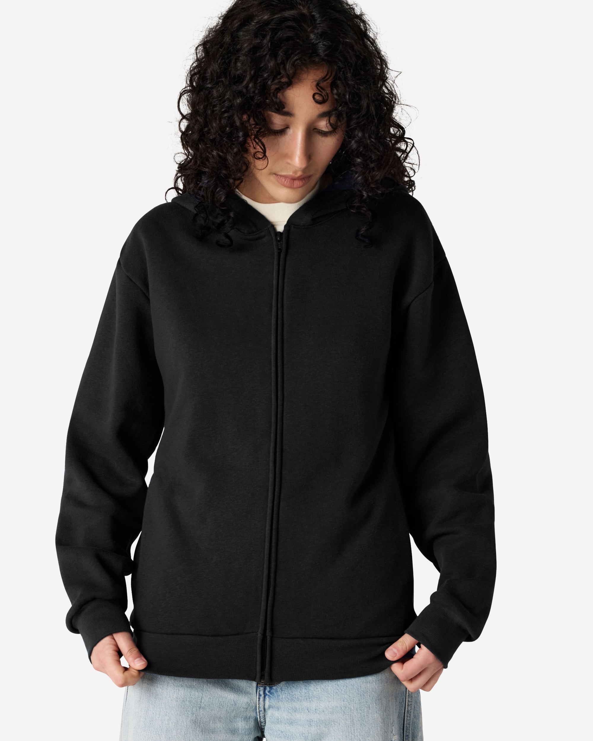 Female model wearing Reflex Unisex Full Zip Hooded Sweatshirt pairing with blue jeans (front pose) -black