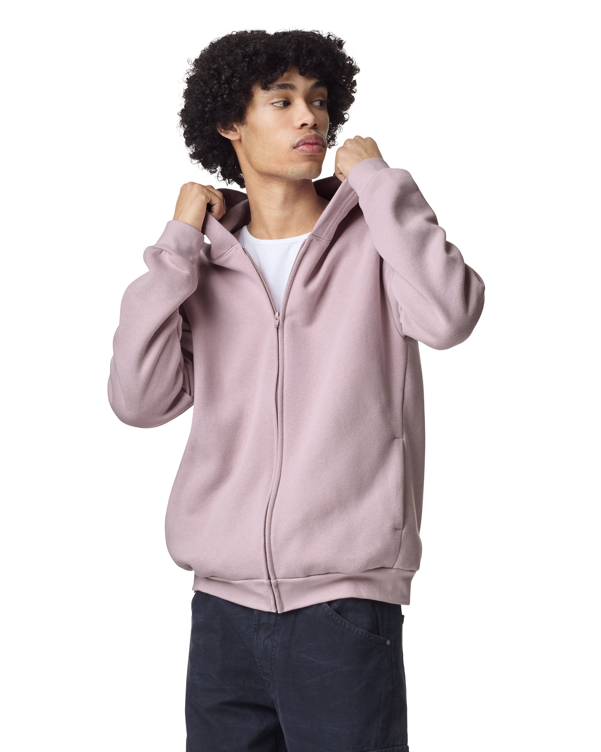 Male model wearing Reflex Unisex Full Zip Hooded Sweatshirt pairing with black jeans (front pose) -blush