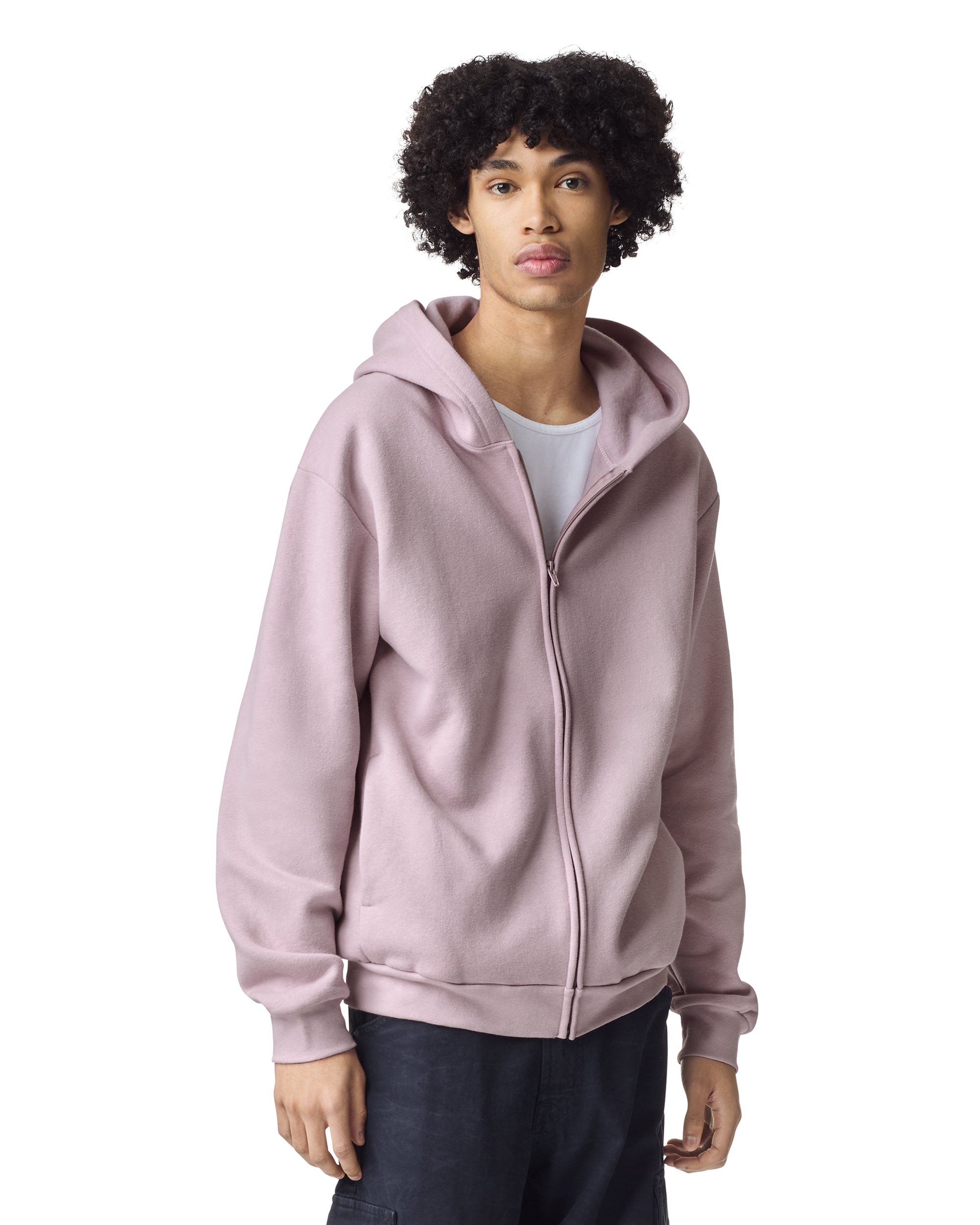 Male model wearing Reflex Unisex Full Zip Hooded Sweatshirt pairing with black jeans (front pose) -blush