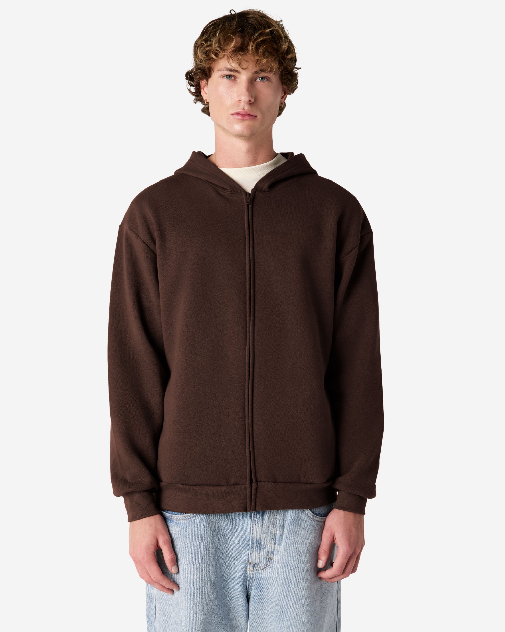 Male model wearing Reflex Unisex Full Zip Hooded Sweatshirt pairing with blue jeans (side front pose) -brown