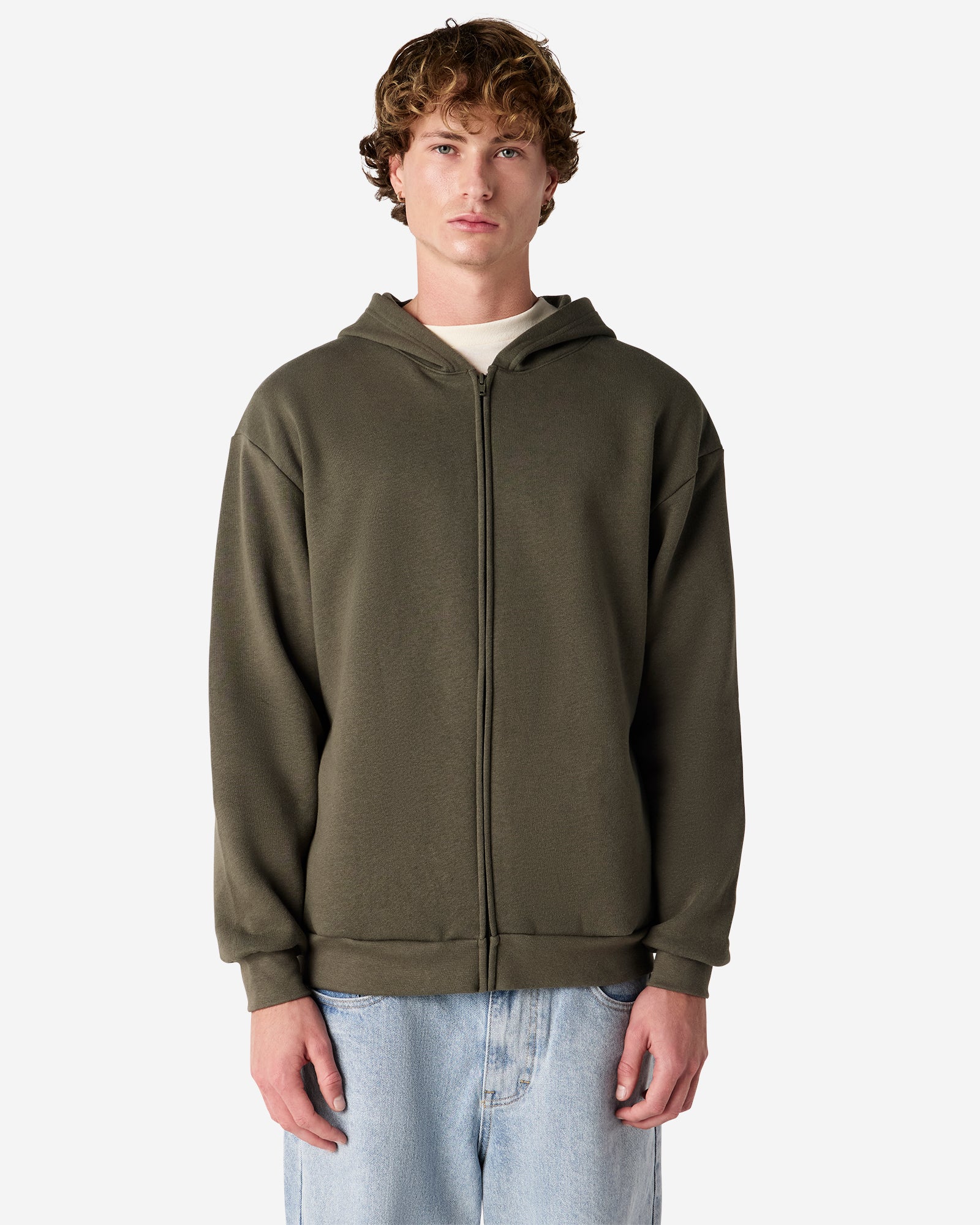 Male model wearing Reflex Unisex Full Zip Hooded Sweatshirt pairing with blue jeans (front pose) -lieutenant