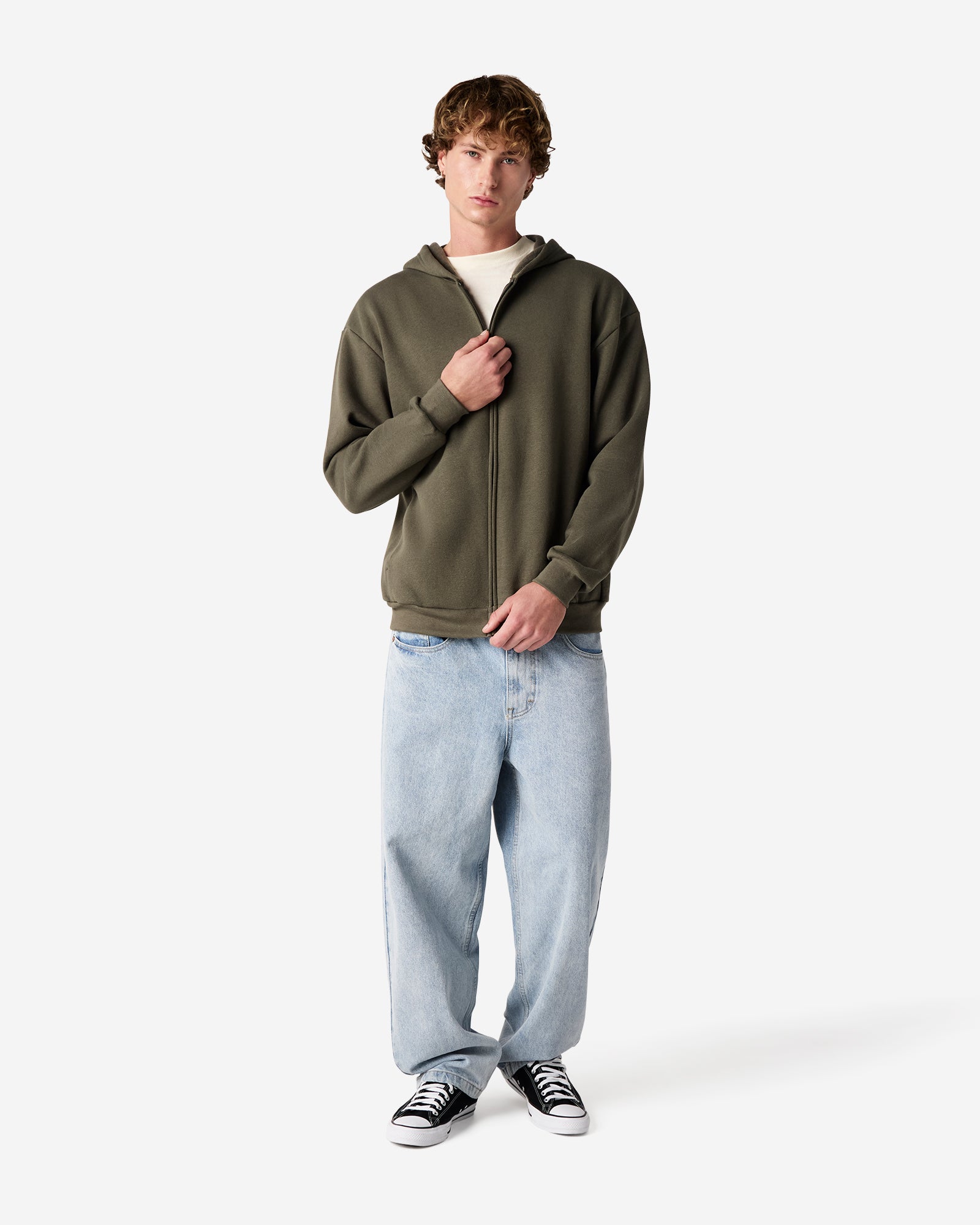 Male model wearing Reflex Unisex Full Zip Hooded Sweatshirt pairing with blue jeans (front pose) -lieutenant