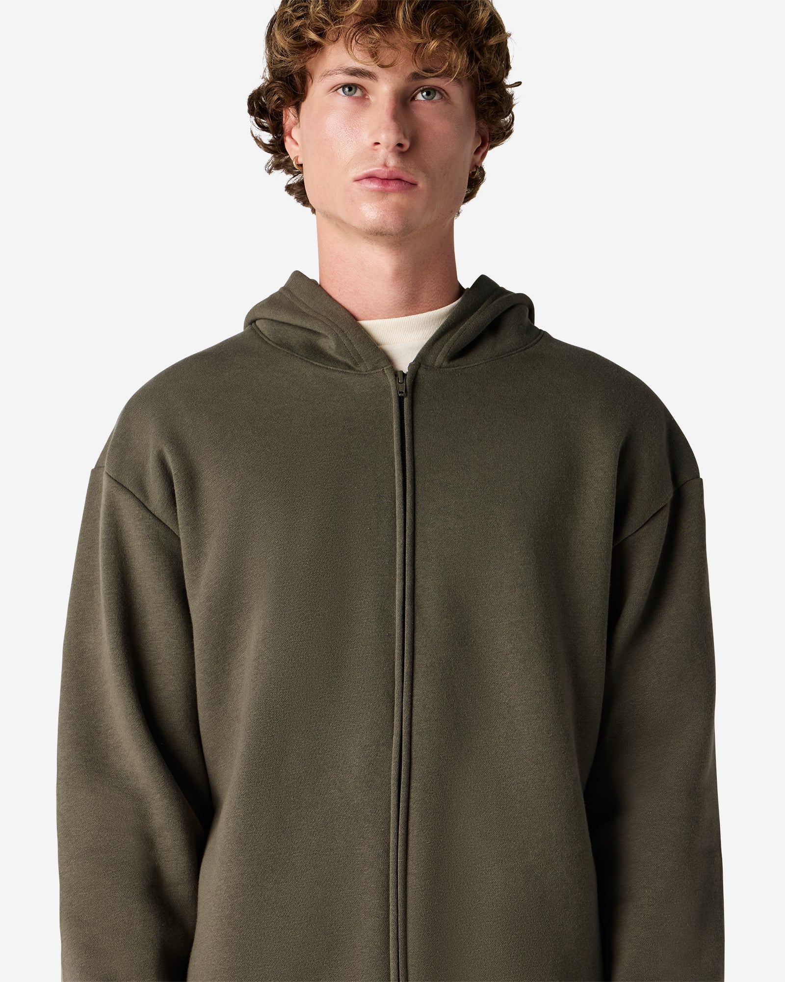 Male model wearing Reflex Unisex Full Zip Hooded Sweatshirt pairing with blue jeans (front pose) -lieutenant