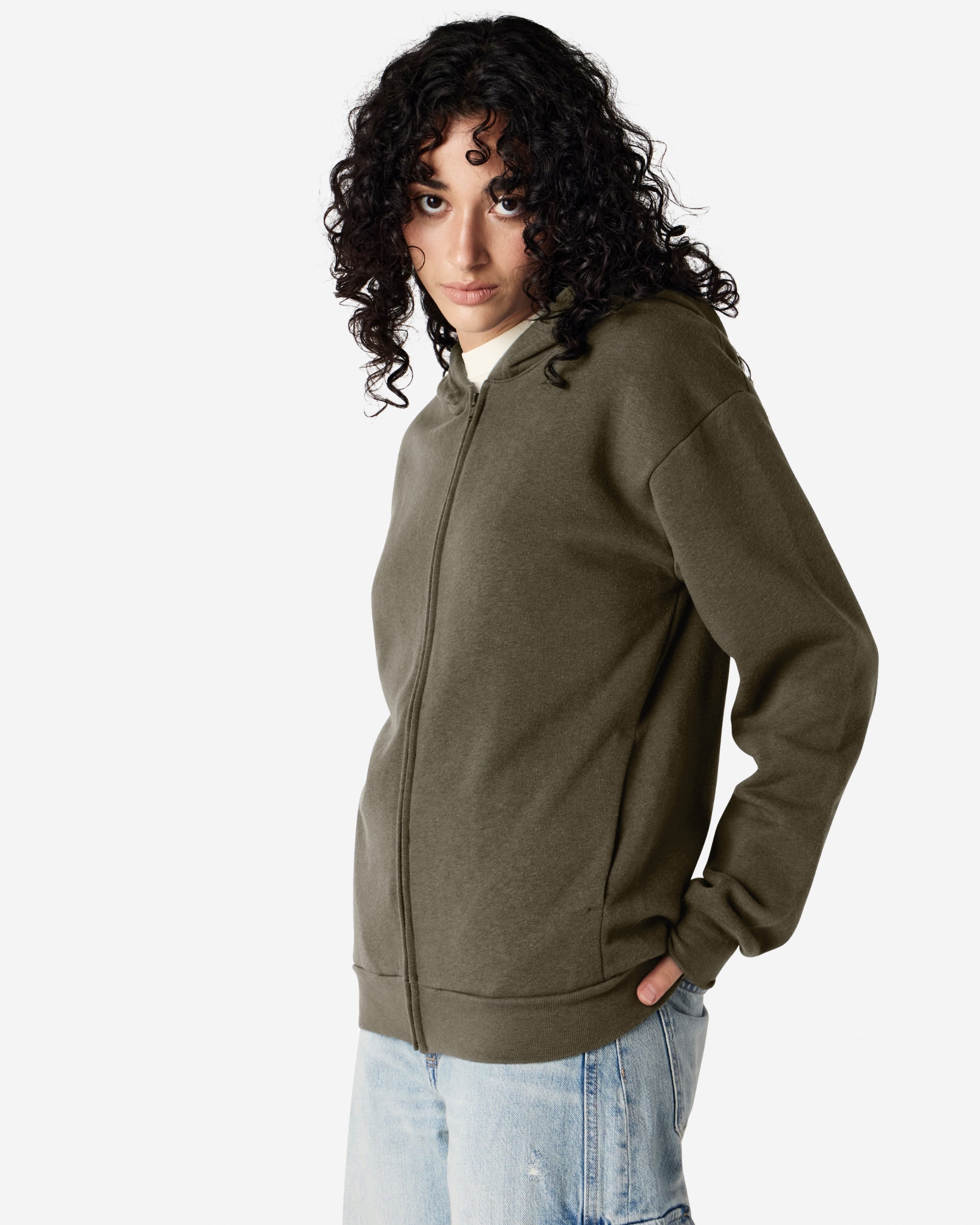 Female model wearing Reflex Unisex Full Zip Hooded Sweatshirt pairing with blue jeans (front pose) -lieutenant