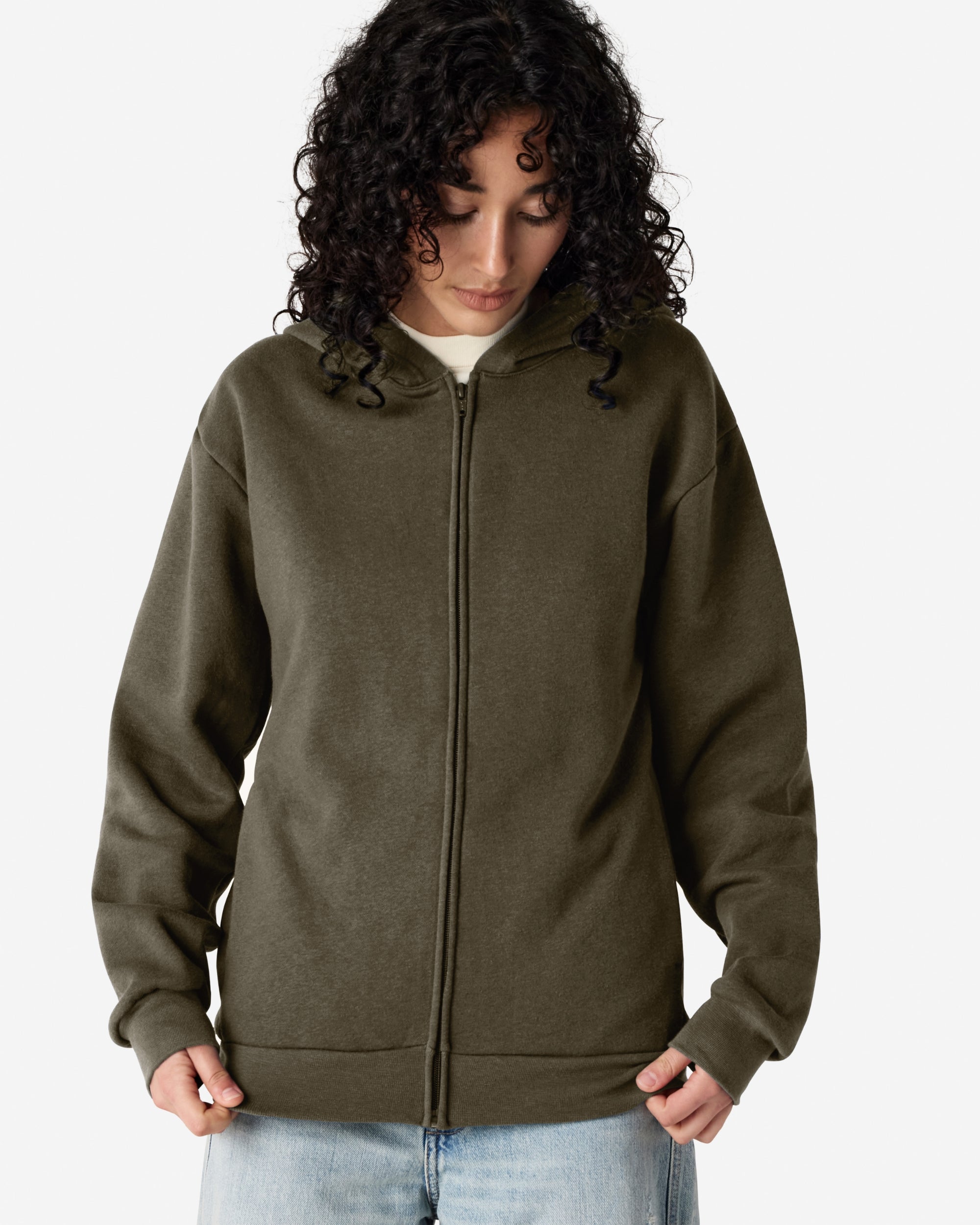 Female model wearing Reflex Unisex Full Zip Hooded Sweatshirt pairing with blue jeans (front pose) -lieutenant