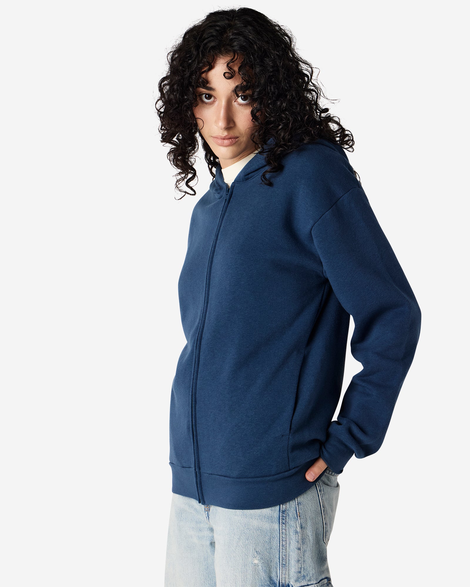 Female model wearing Reflex Unisex Full Zip Hooded Sweatshirt pairing with blue jeans (front side pose) -sea blue
