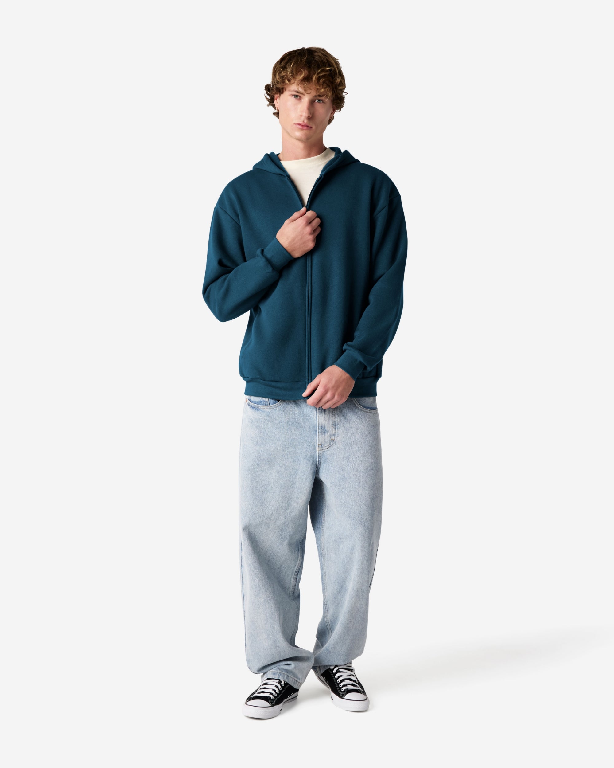 Male model wearing Reflex Unisex Full Zip Hooded Sweatshirt pairing with blue jeans (front pose) -sea blue