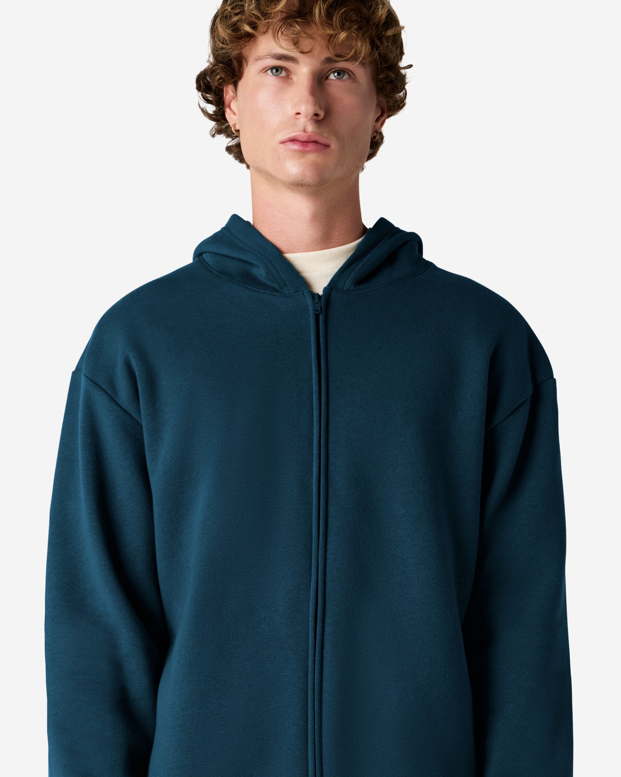Male model wearing Reflex Unisex Full Zip Hooded Sweatshirt pairing with blue jeans (front pose) -sea blue