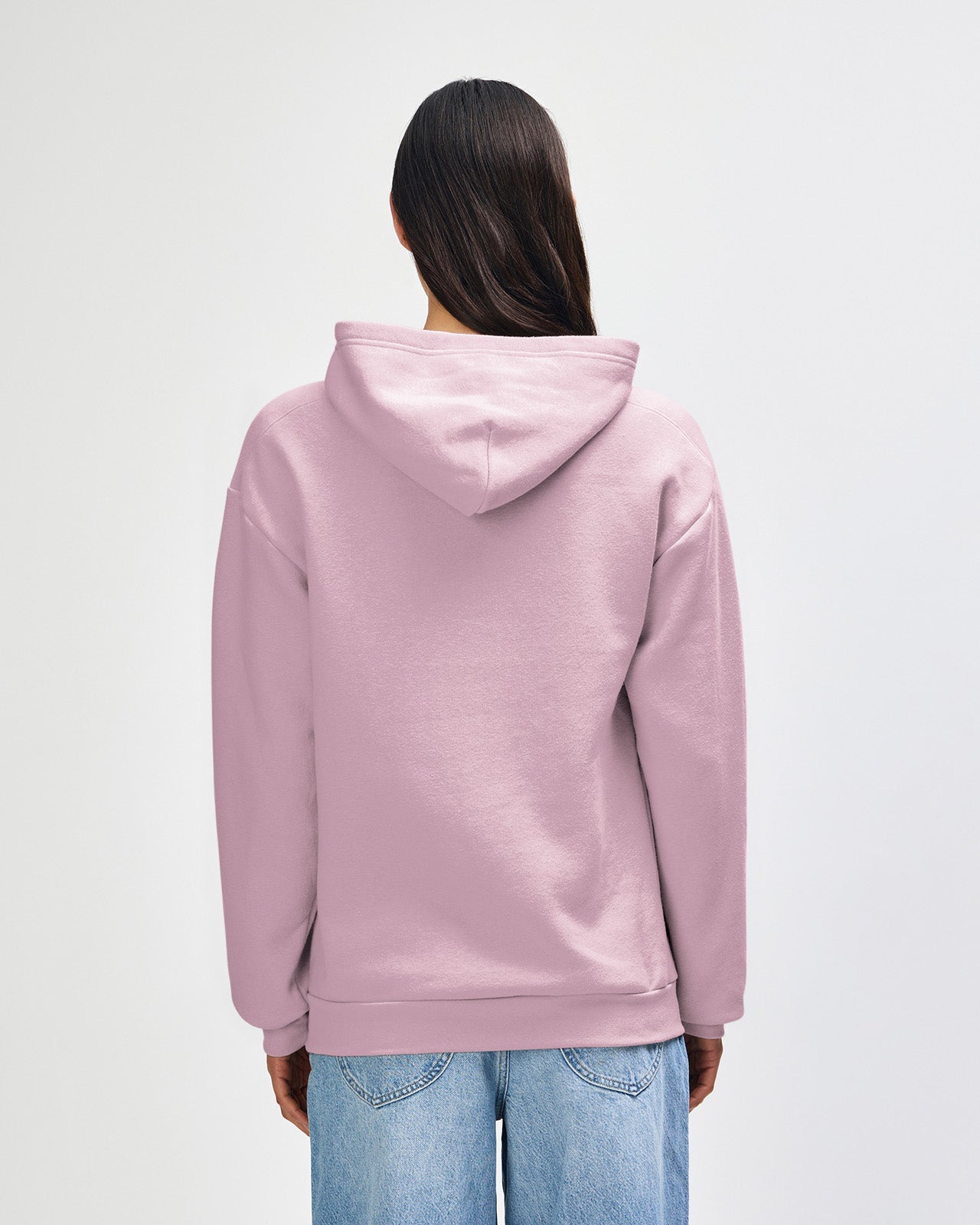Femle model wearing a Reflex Unisex Hooded Sweatshirt (back pose) - Blush