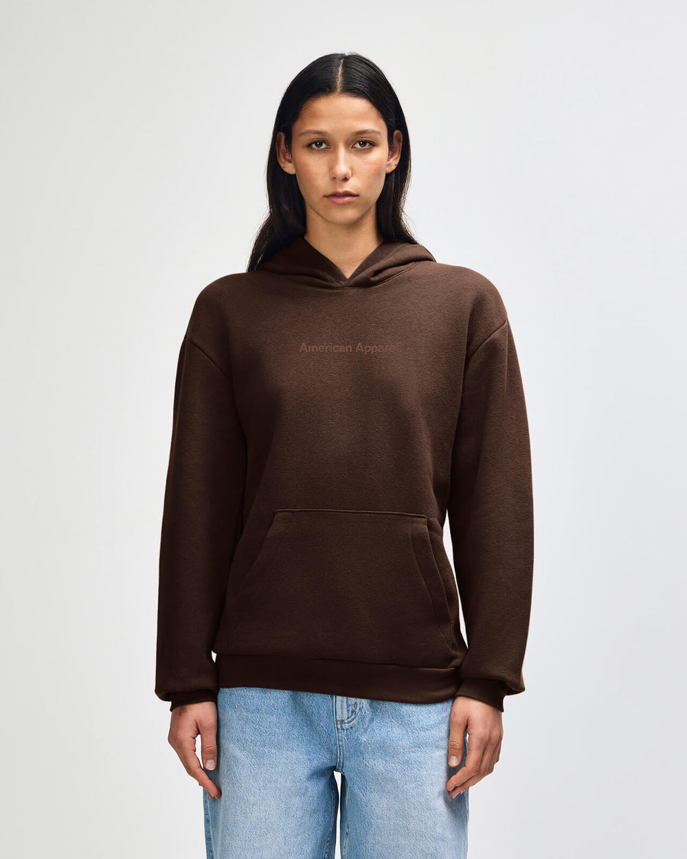 image of Pullover Hoodie Tracksuit Set - Embroidered Logo - Brown : Person wearing a brown hoodie and light blue jeans on a white background -brown