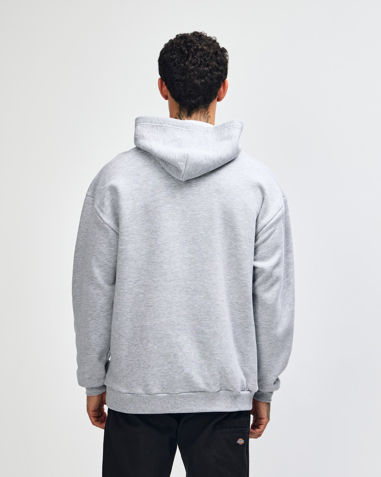 Male model wearing a Reflex Unisex Hooded Sweatshirt (front pose) -heather grey
