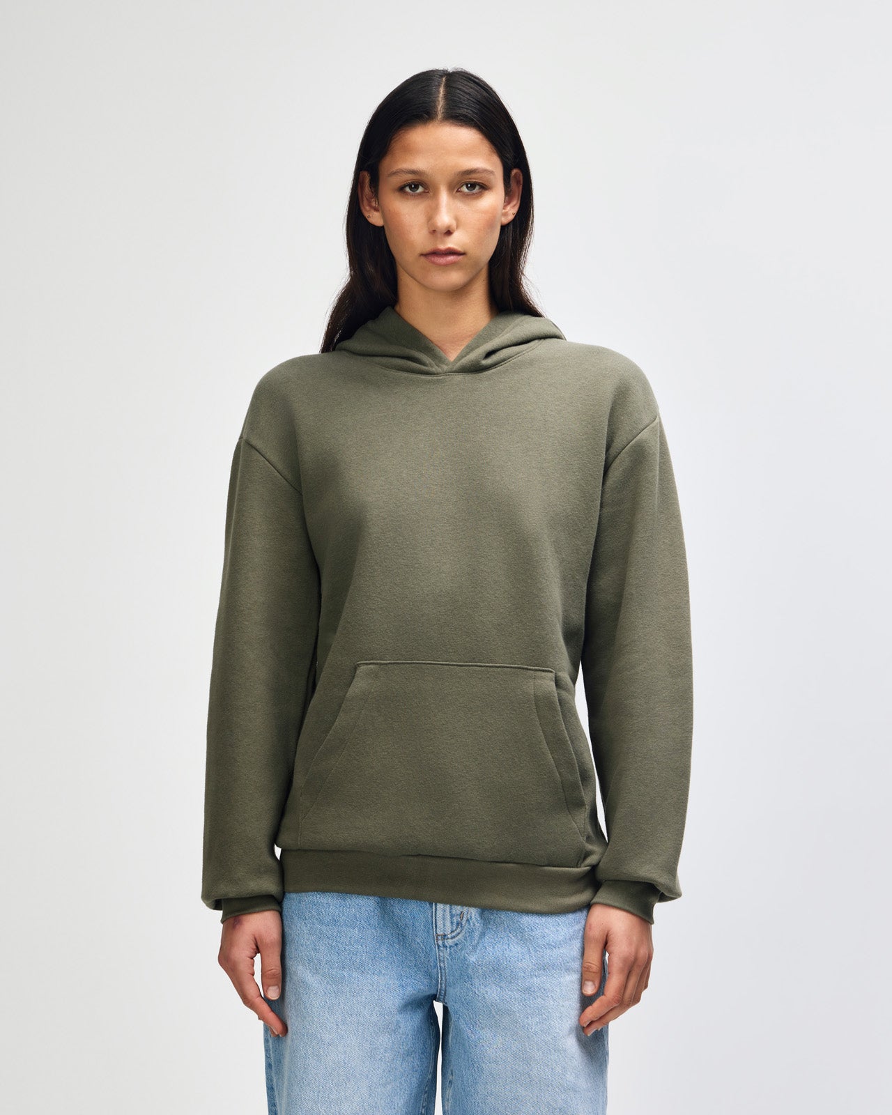Female model wearing a Reflex Unisex Hooded Sweatshirt (front pose) -lieutenant