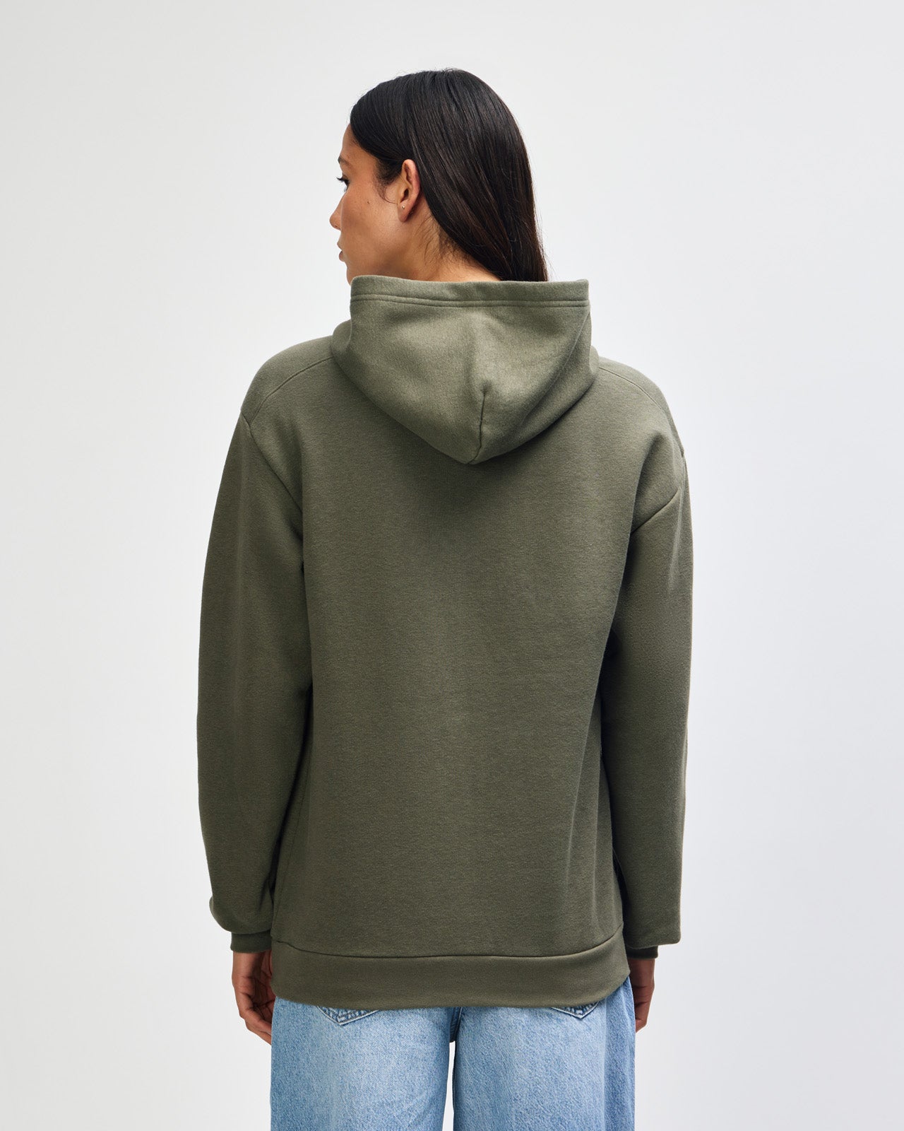 Female model wearing a Reflex Unisex Hooded Sweatshirt (back pose) -lieutenant