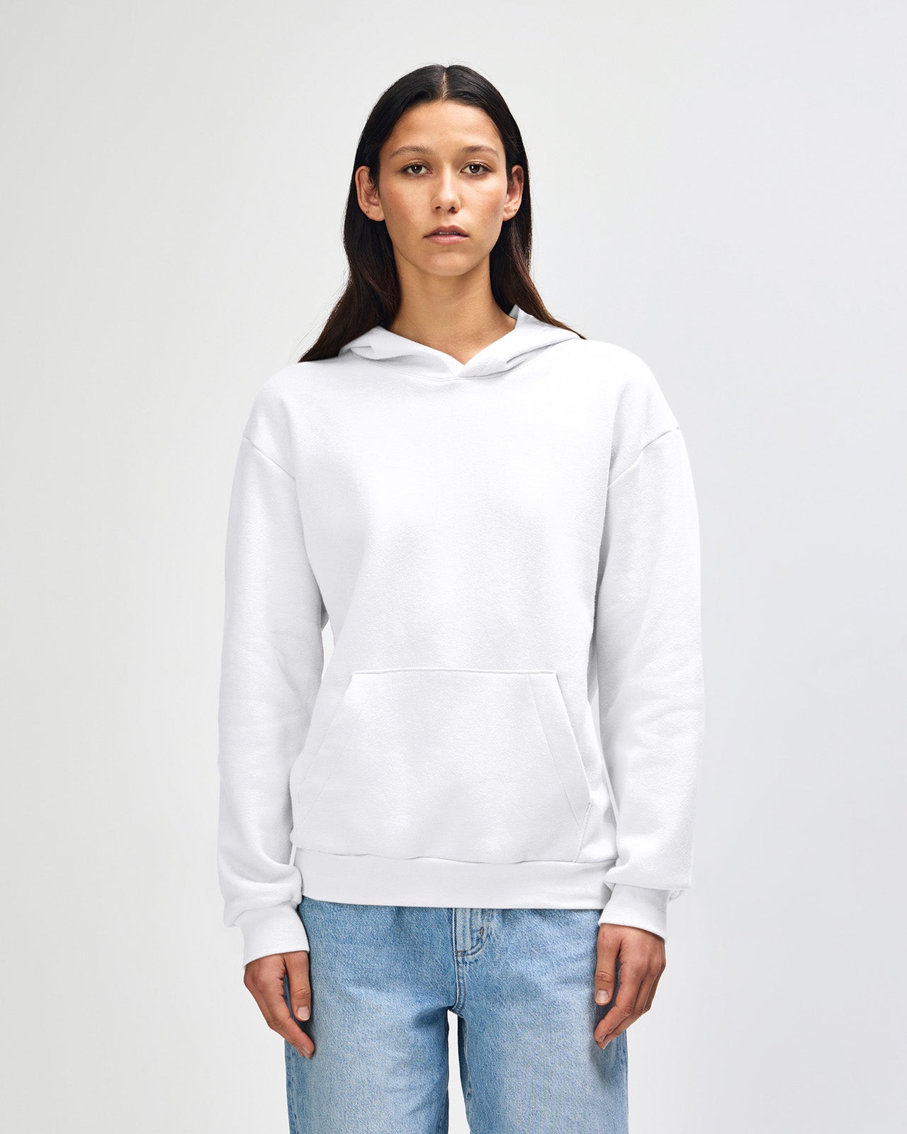 Female model wearing a Reflex Unisex Hooded Sweatshirt (front pose) -white
