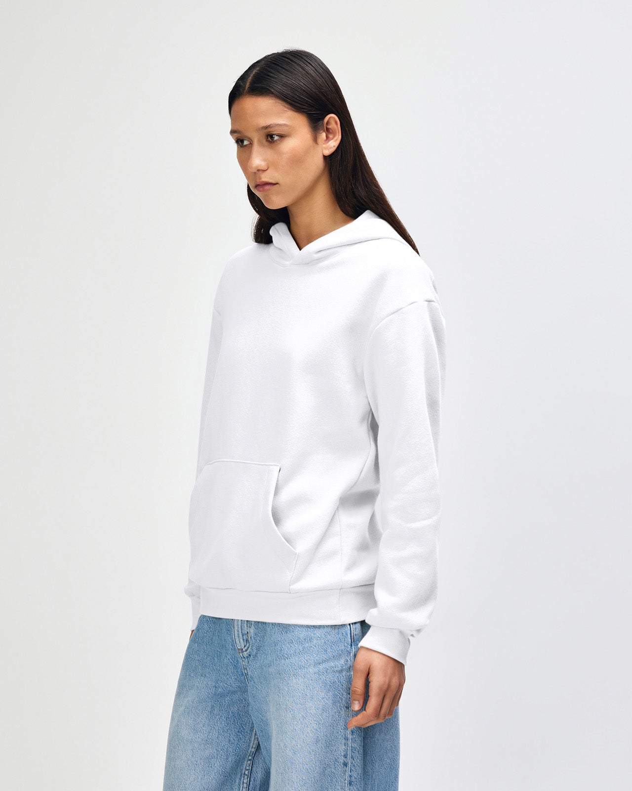 Female model wearing a Reflex Unisex Hooded Sweatshirt (front pose) -white