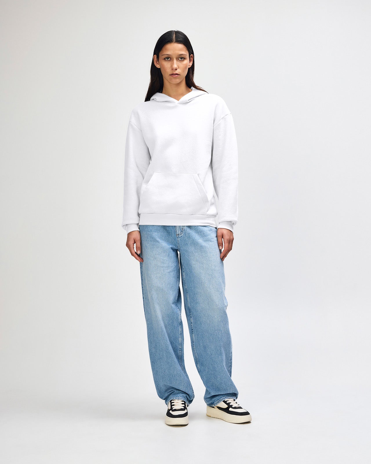 Female model wearing a Reflex Unisex Hooded Sweatshirt (front pose) -white