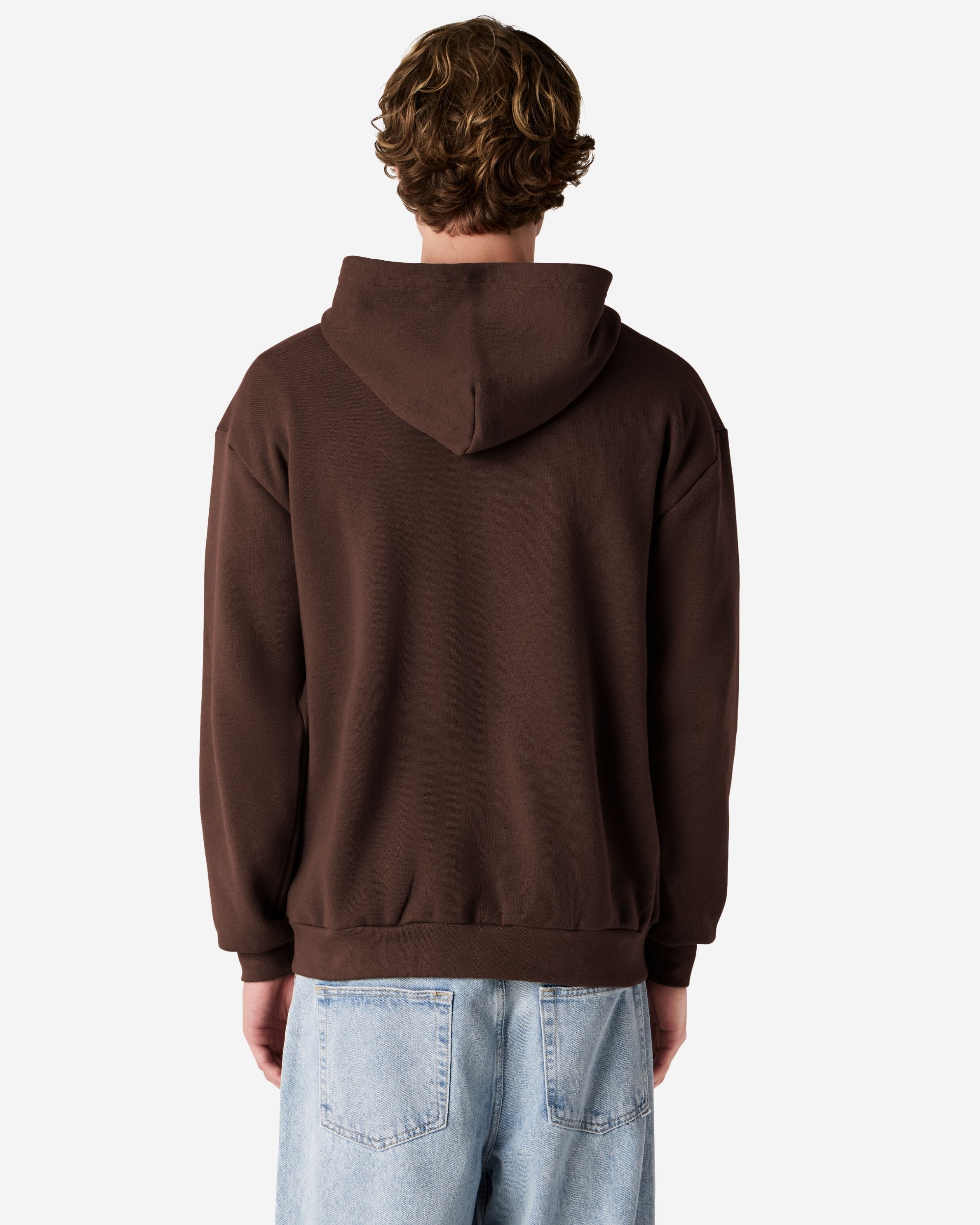 Male model wearing Reflex Unisex Full Zip Hooded Sweatshirt pairing with blue jeans (side front pose) -brown